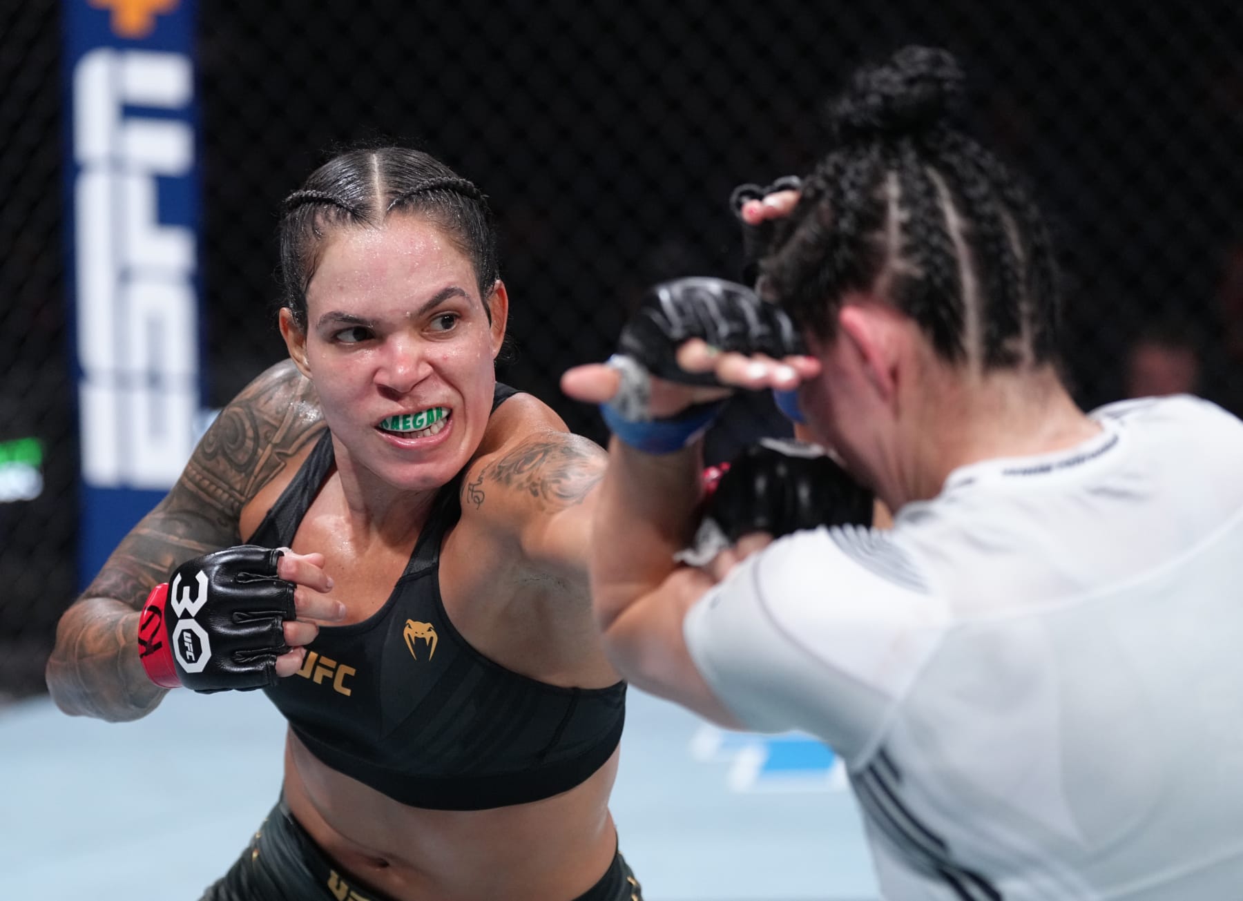 VANCOUVER, BRITISH COLUMBIA - JUNE 10:  (L-R) Amanda Nunes of Brazil punches Irene Aldana of Mexico in their women's bantamweight title fight during the UFC 289 event at Rogers Arena on June 10, 2023 in Vancouver, Canada. (Photo by Jeff Bottari/Zuffa LLC)