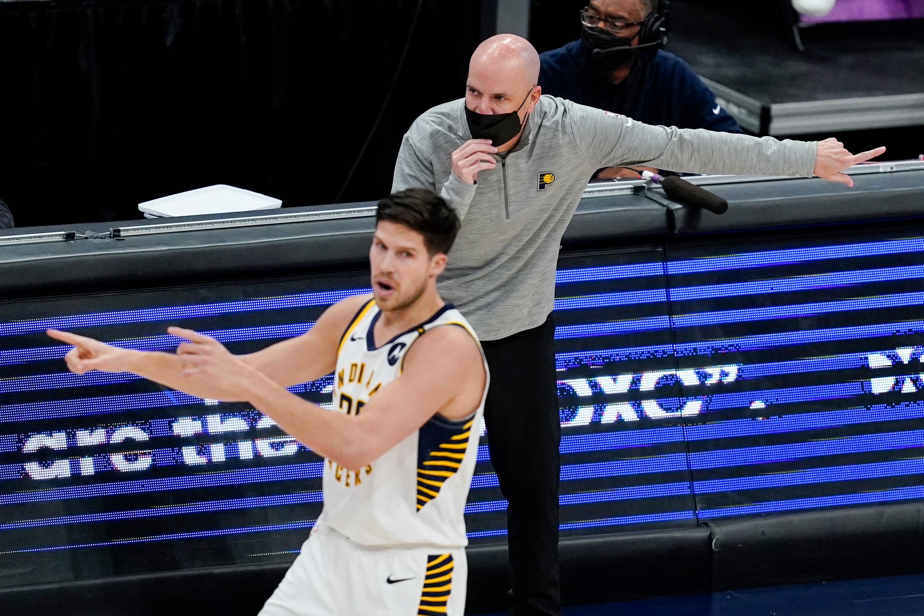 Indiana Pacers head coach Nate Bjorkgren directs his team behind Indiana Pacers forward Doug McDermott (20) during the second half of a basketball game against the Washington Wizards, Monday, May 3, 2021, in Washington. (AP Photo/Alex Brandon)