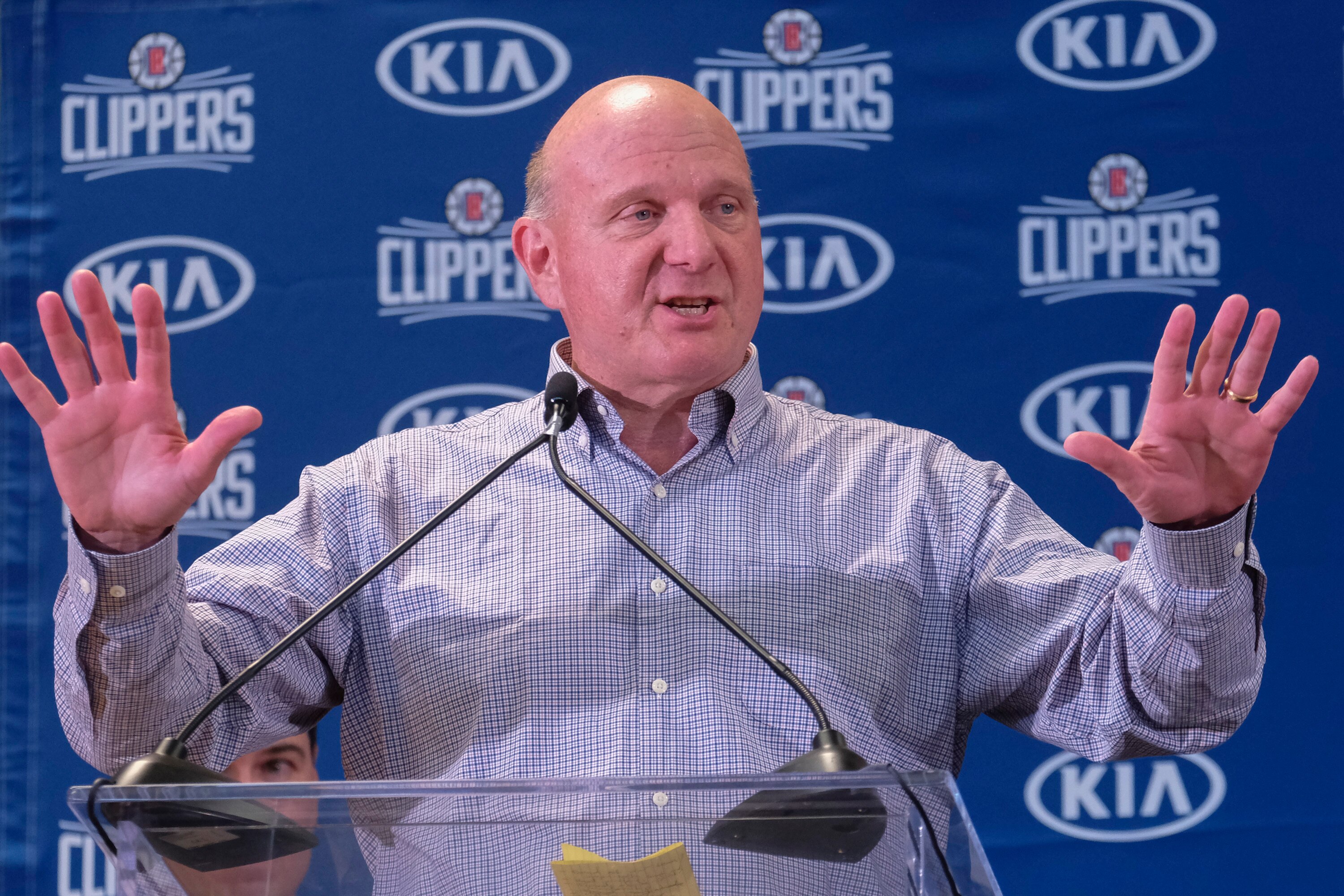 From left, Los Angeles Clippers team chairman Steve Ballmer introduces Paul George and Kawhi Leonard at a press conference at the Green Meadows Recreation Center in Los Angeles, Wednesday, July 23, 2019. (AP Photo/Ringo H.W. Chiu)