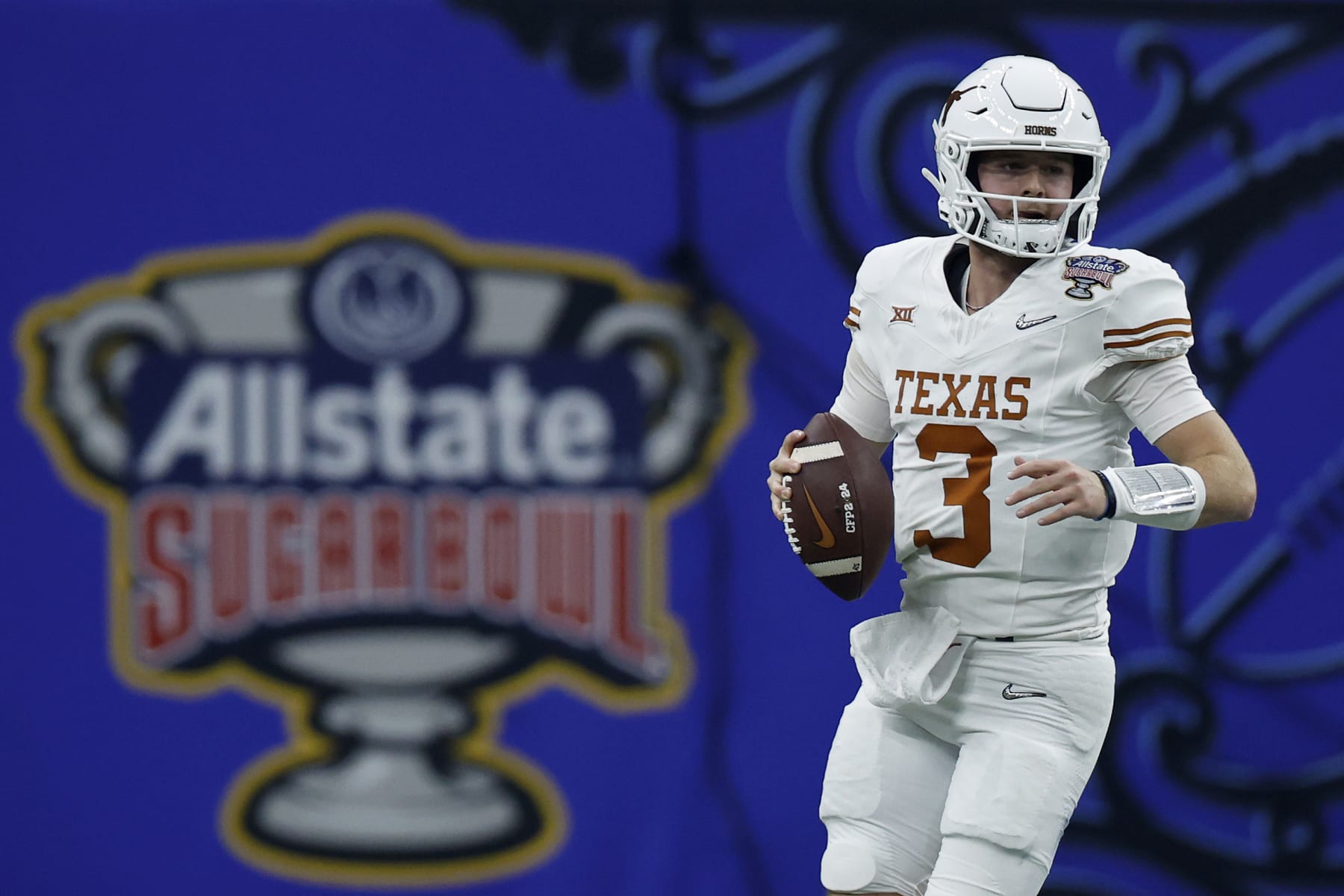 NEW ORLEANS, LOUISIANA - JANUARY 01: Quinn Ewers #3 of the Texas Longhorns looks to pass during the first quarter against the Washington Huskies during the CFP Semifinal Allstate Sugar Bowl at Caesars Superdome on January 01, 2024 in New Orleans, Louisiana. (Photo by Chris Graythen/Getty Images)