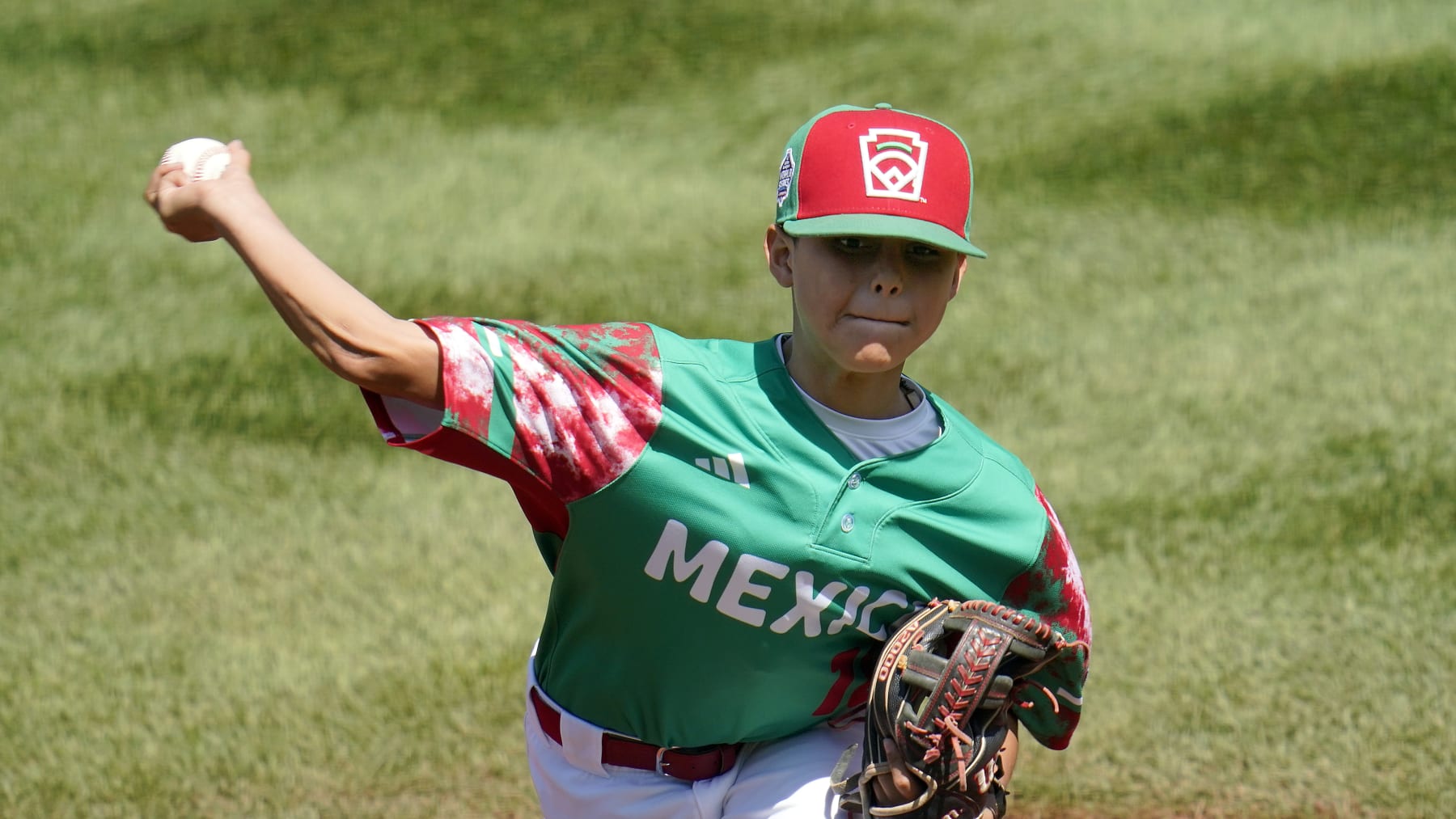 Mexico's Gael Leyva (18) delivers a pitch against Venezuela during the first inning of a baseball game at the Little League World Series tournament in South Williamsport, Pa., Tuesday, Aug. 22, 2023. (AP Photo/Tom E. Puskar)