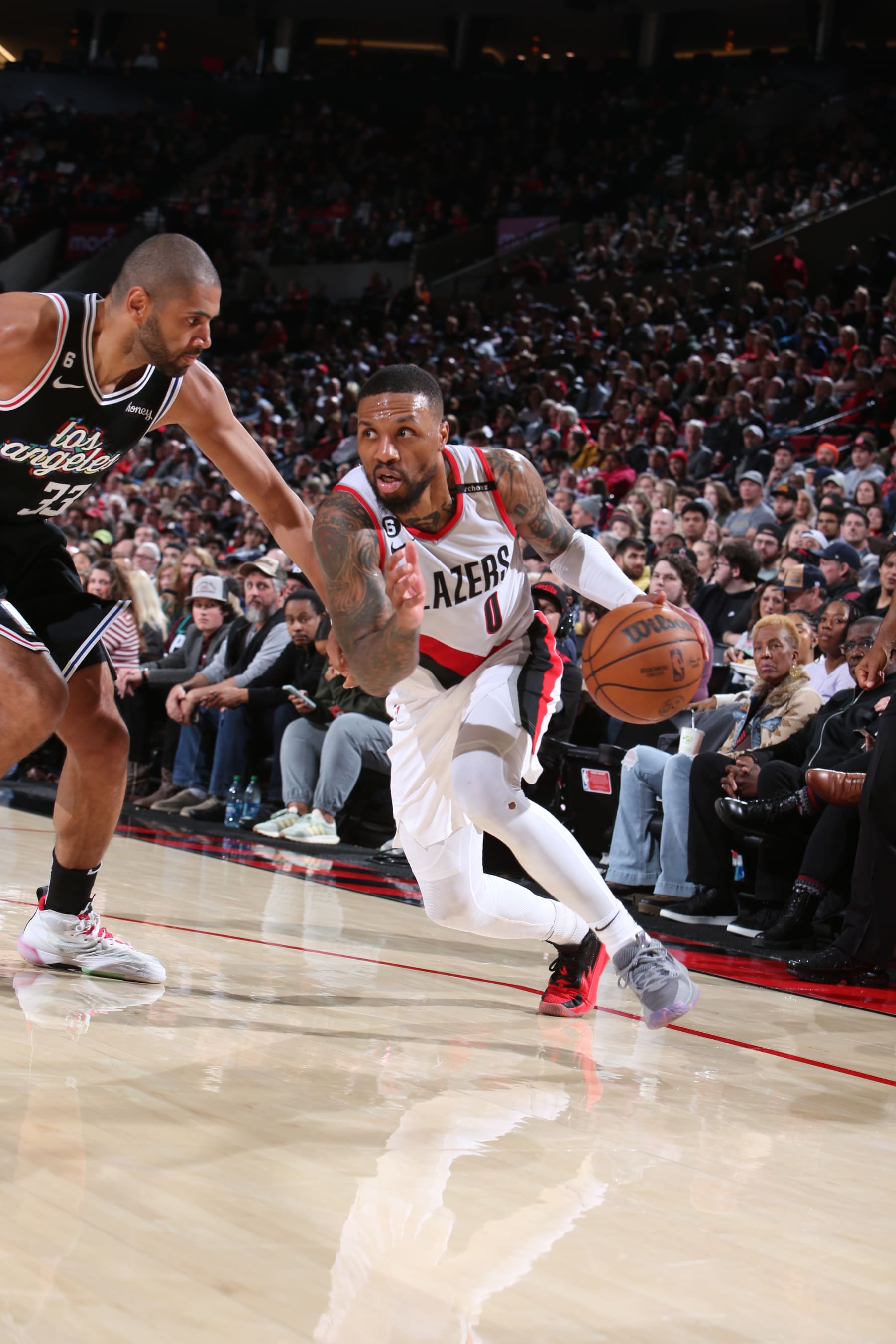 PORTLAND, OR - MARCH 19: Damian Lillard #0 of the Portland Trail Blazers drives to the basket during the game against the LA Clippers on March 19, 2023 at the Moda Center Arena in Portland, Oregon. NOTE TO USER: User expressly acknowledges and agrees that, by downloading and or using this photograph, user is consenting to the terms and conditions of the Getty Images License Agreement. Mandatory Copyright Notice: Copyright 2023 NBAE (Photo by Sam Forencich/NBAE via Getty Images)