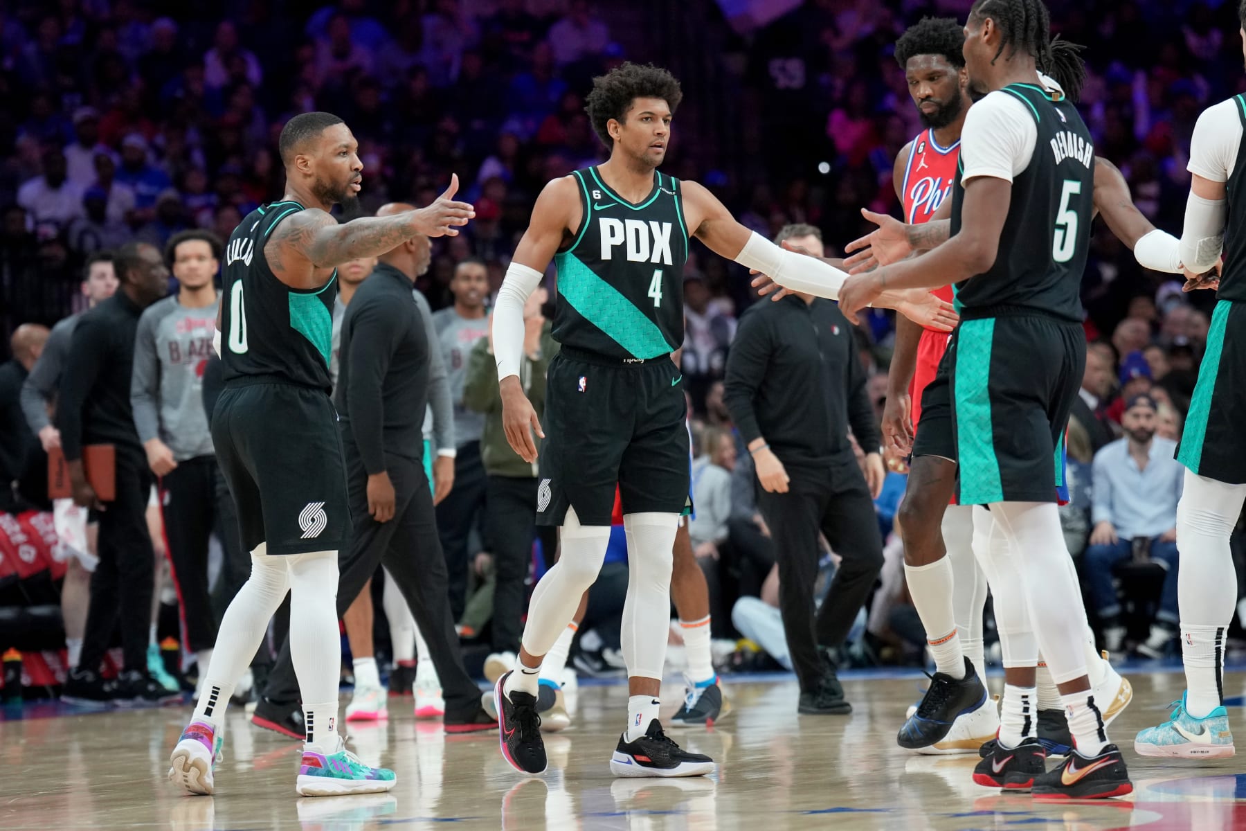 Damian Lillard, Cam Reddish and Matisse Thybulle
