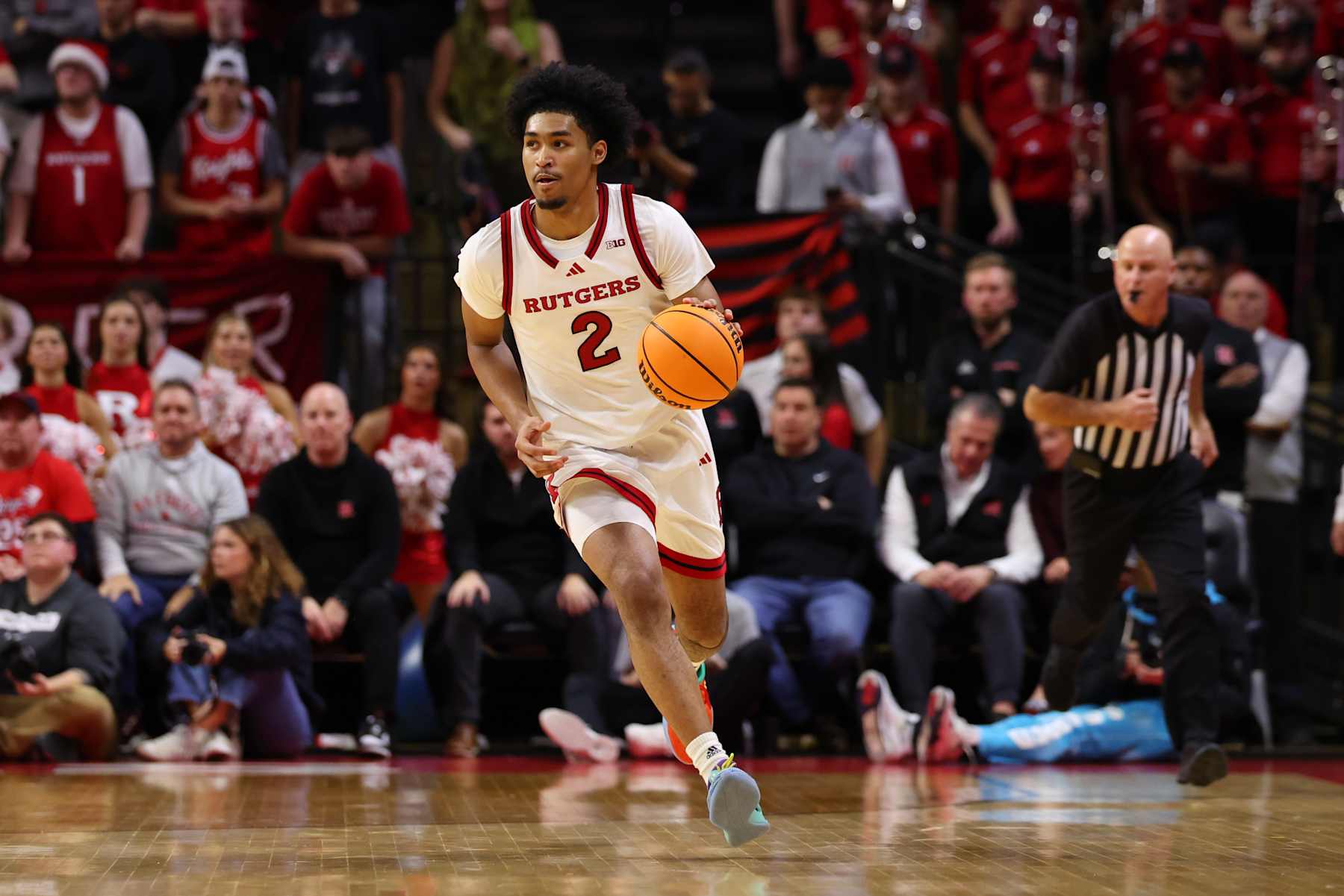 PISCATAWAY, NEW JERSEY - DECEMBER 10: Dylan Harper #2 of the Rutgers Scarlet Knights dribbles the ball during the second half of their game against the Penn State Nittany Lions at Jersey Mike's Arena on December 10, 2024 in Piscataway, New Jersey. (Photo by Ed Mulholland/Getty Images)