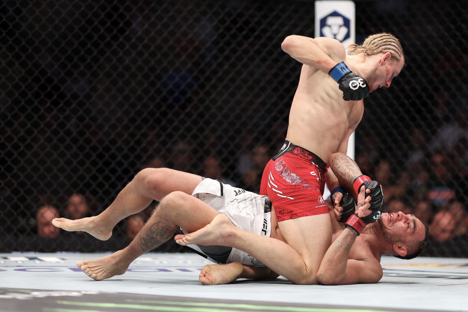 LAS VEGAS, NEVADA - DECEMBER 16: Paddy Pimblett of England (top) punches Tony Ferguson of the United States in a lightweight fight during the UFC 296: Edwards vs. Covington event at T-Mobile Arena on December 16, 2023 in Las Vegas, Nevada. (Photo by Sean M. Haffey/Getty Images)