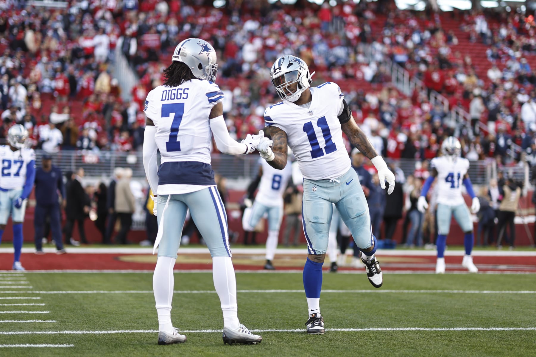 SANTA CLARA, CALIFORNIA - JANUARY 22: Micah Parsons #11 of the Dallas Cowboys shakes hands with Trevon Diggs #7 of the Dallas Cowboys prior to an NFL divisional round playoff football game between the San Francisco 49ers and the Dallas Cowboys at Levi's Stadium on January 22, 2023 in Santa Clara, California. (Photo by Michael Owens/Getty Images)