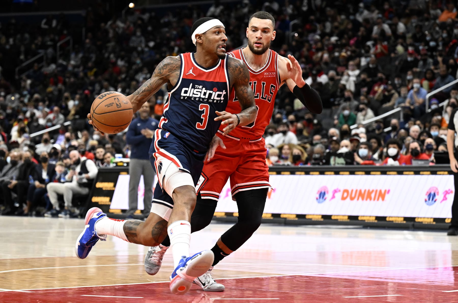 WASHINGTON, DC - JANUARY 01: Bradley Beal #3 of the Washington Wizards handles the ball in the first half against Zach LaVine #8 of the Chicago Bulls at Capital One Arena on January 01, 2022 in Washington, DC.  NOTE TO USER: User expressly acknowledges and agrees that, by downloading and or using this photograph, User is consenting to the terms and conditions of the Getty Images License Agreement. (Photo by G Fiume/Getty Images)
