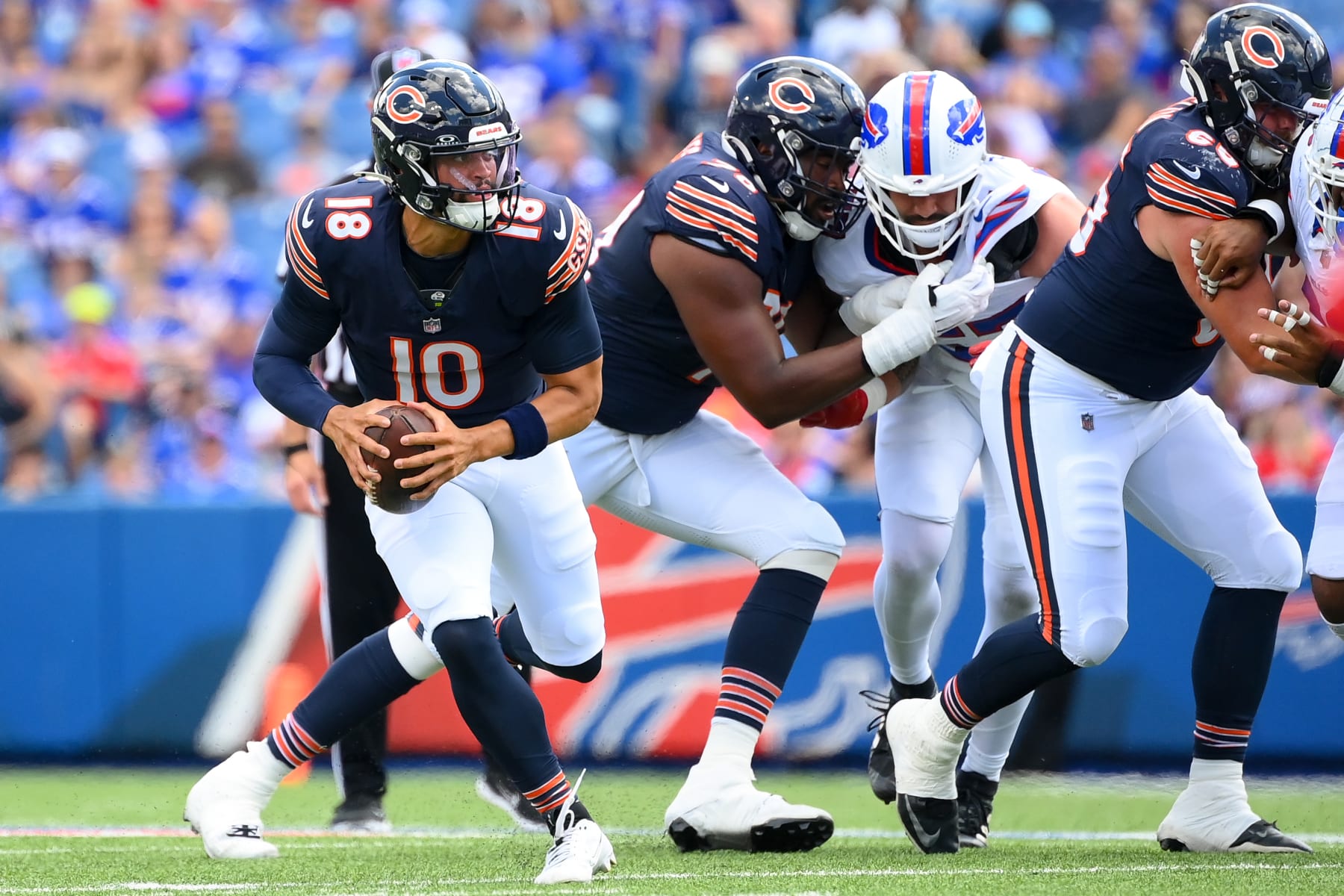 ORCHARD PARK, NEW YORK - AUGUST 10: Caleb Williams #18 of the Chicago Bears runs with the ball against the Buffalo Bills during the first half of a preseason game at Highmark Stadium on August 10, 2024 in Orchard Park, New York. (Photo by Rich Barnes/Getty Images)