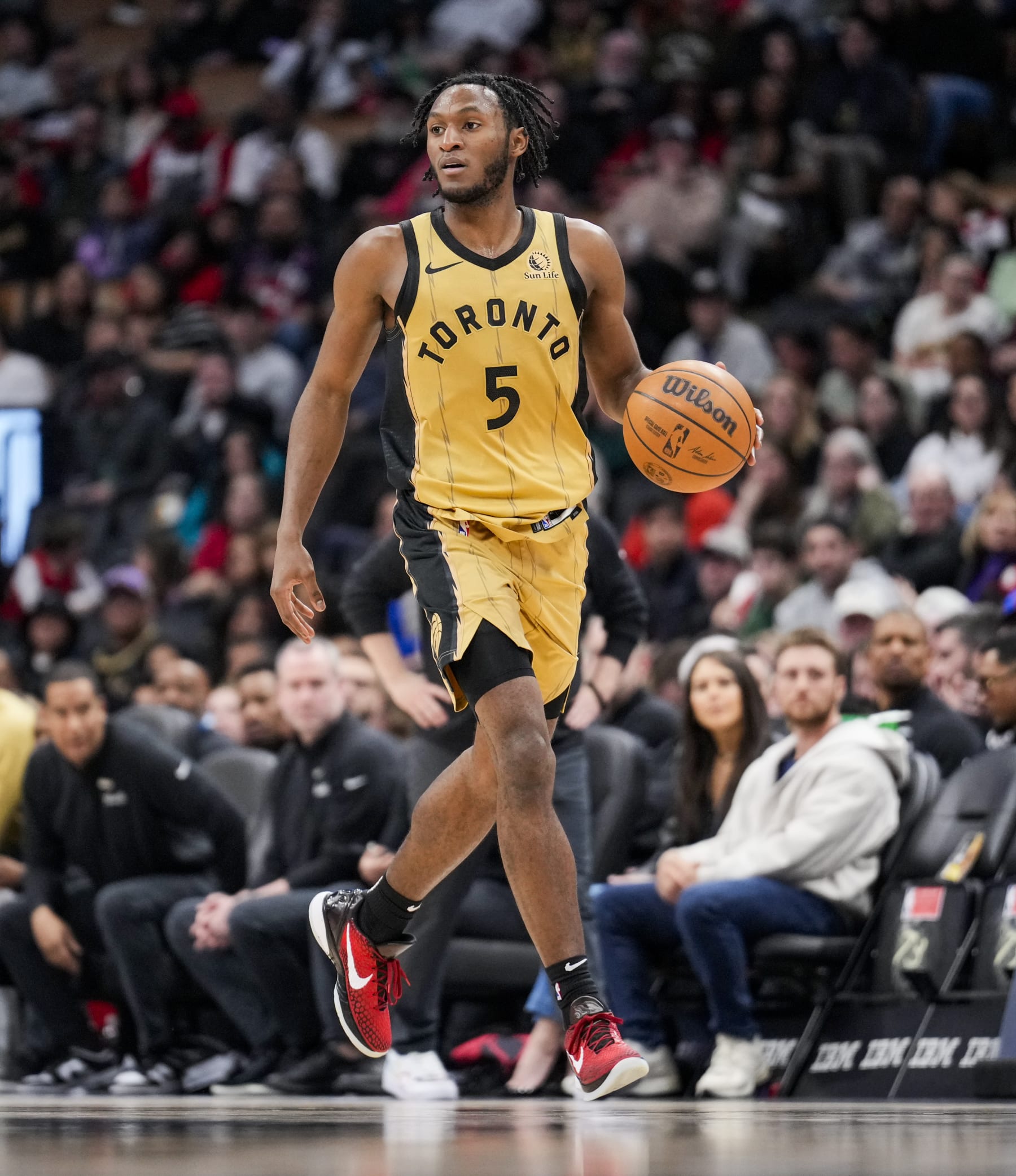 TORONTO, ON - APRIL 7: Immanuel Quickley #5 of the Toronto Raptors dribbles against the Washington Wizards during the second half of their basketball game at the Scotiabank Arena on April 7, 2024 in Toronto, Ontario, Canada. NOTE TO USER: User expressly acknowledges and agrees that, by downloading and/or using this Photograph, user is consenting to the terms and conditions of the Getty Images License Agreement. (Photo by Mark Blinch/Getty Images)
