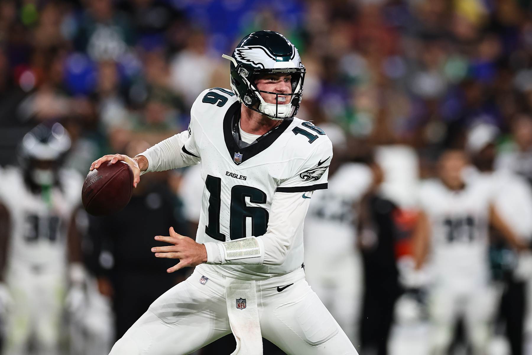 BALTIMORE, MD - AUGUST 09: Tanner McKee #16 of the Philadelphia Eagles looks to pass against the Baltimore Ravens during the second half of a preseason game at M&T Bank Stadium on August 9, 2024 in Baltimore, Maryland. (Photo by Scott Taetsch/Getty Images)