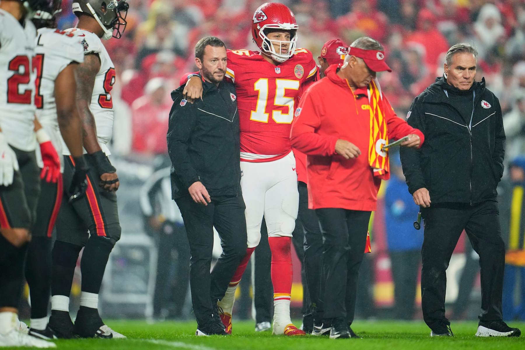 KANSAS CITY, MO - NOVEMBER 04: Patrick Mahomes #15 of the Kansas City Chiefs is helped off the field against the Tampa Bay Buccaneers during the second half of an NFL football game at GEHA Field at Arrowhead Stadium on November 4, 2024 in Kansas City, Missouri. (Photo by Cooper Neill/Getty Images)