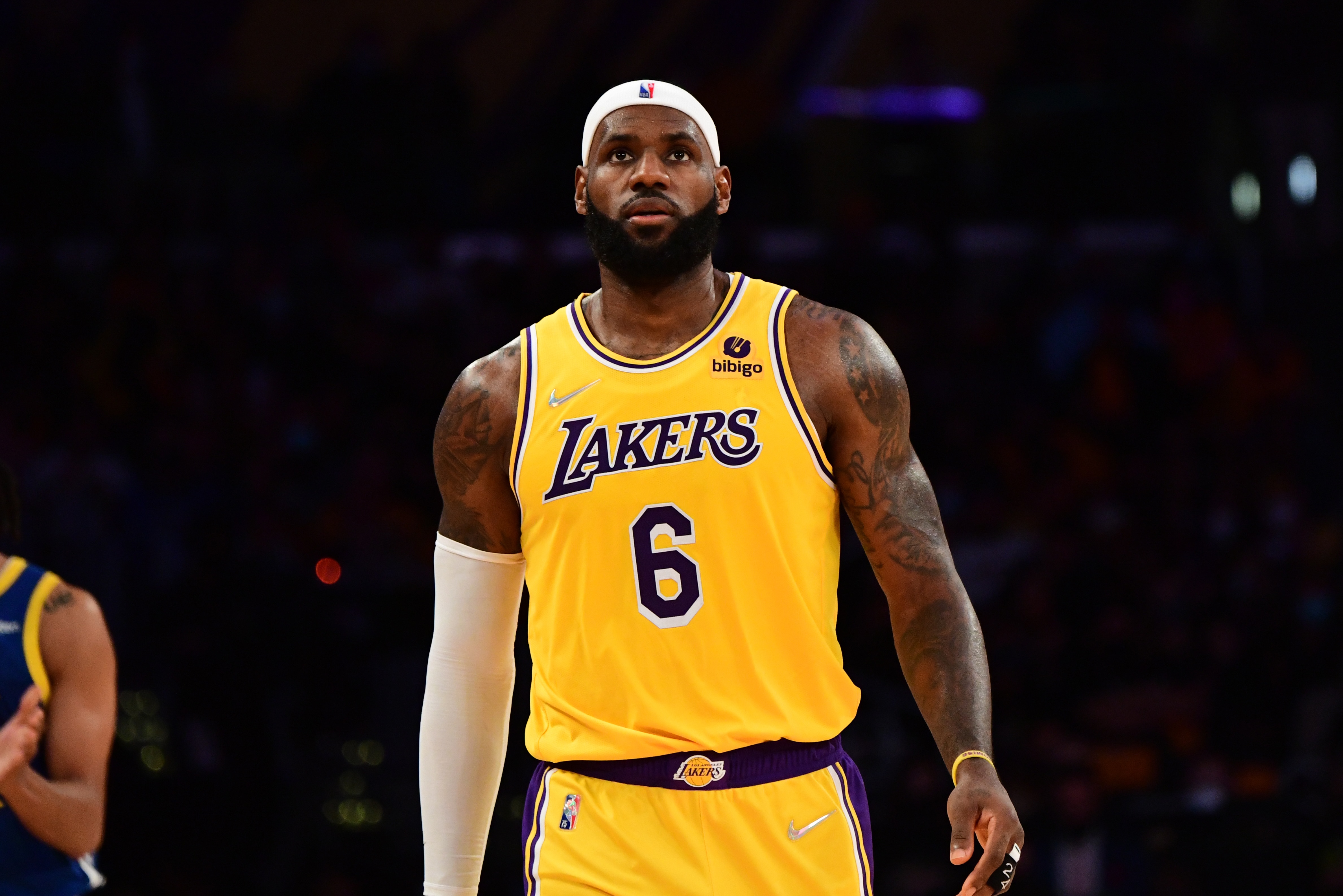 LOS ANGELES, CA - OCTOBER 19: LeBron James #6 of the Los Angeles Lakers looks on during the game against the Golden State Warriors on October 19, 2021 at STAPLES Center in Los Angeles, California. NOTE TO USER: User expressly acknowledges and agrees that, by downloading and/or using this Photograph, user is consenting to the terms and conditions of the Getty Images License Agreement. Mandatory Copyright Notice: Copyright 2021 NBAE (Photo by Adam Pantozzi/NBAE via Getty Images)