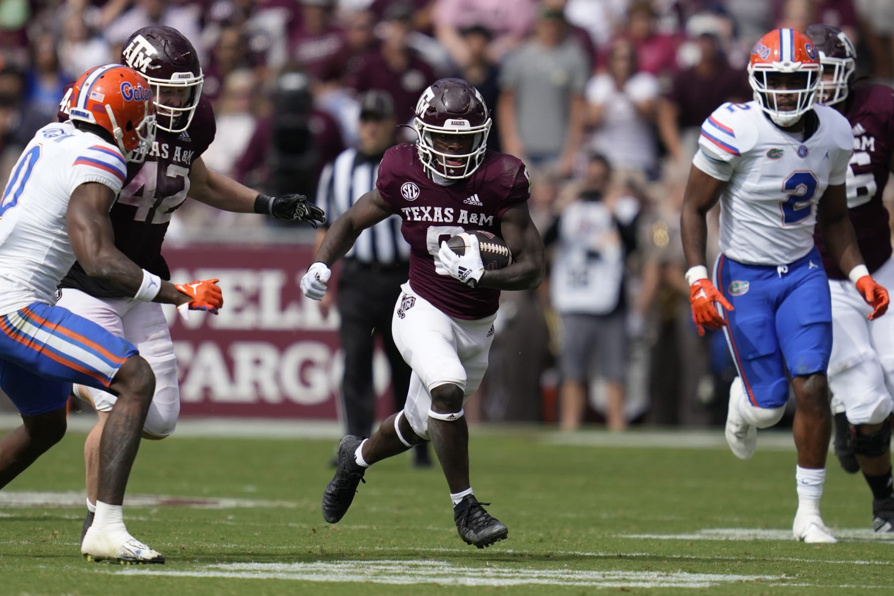 Texas A&M running back Devon Achane (6) breaks free from the pocket for a big gain against Florida during the second half of an NCAA college football game Saturday, Nov. 5, 2022, in College Station, Texas. (AP Photo/Sam Craft)