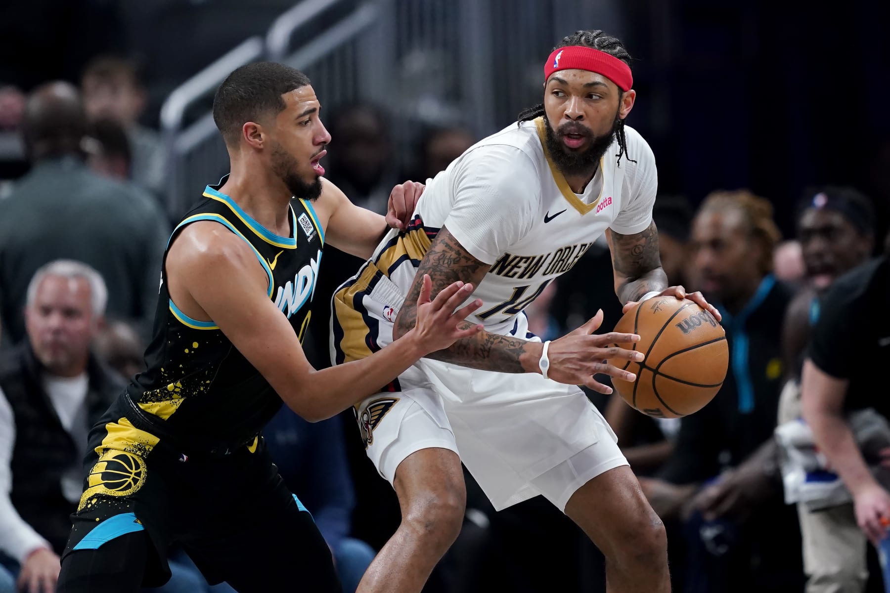 INDIANAPOLIS, INDIANA - FEBRUARY 28: Brandon Ingram #14 of the New Orleans Pelicans dribbles the ball while being guarded by Tyrese Haliburton #0 of the Indiana Pacers in the first quarter at Gainbridge Fieldhouse on February 28, 2024 in Indianapolis, Indiana. NOTE TO USER: User expressly acknowledges and agrees that, by downloading and or using this photograph, User is consenting to the terms and conditions of the Getty Images License Agreement. (Photo by Dylan Buell/Getty Images)