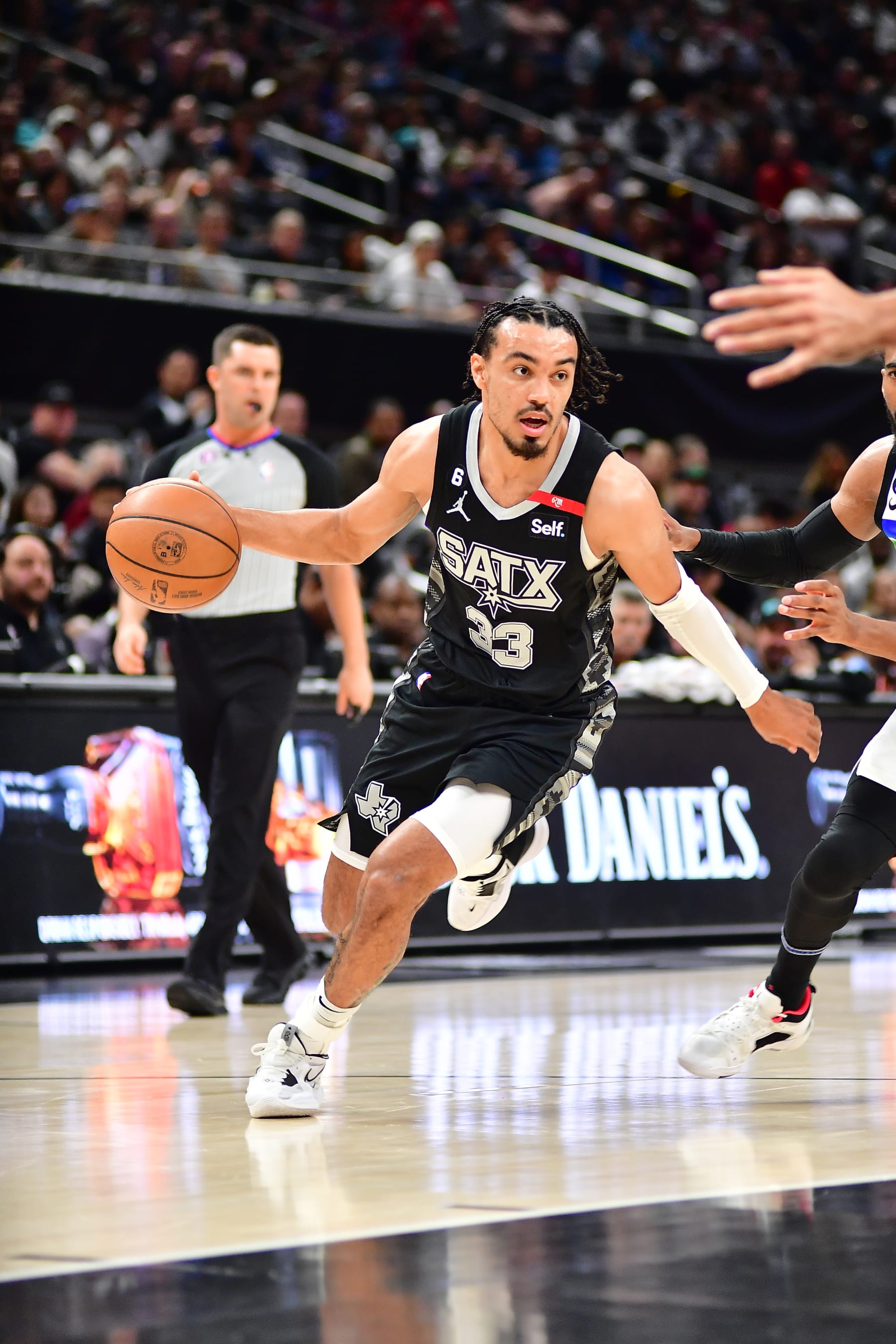 SAN ANTONIO, TX - APRIL 8: Tre Jones #33 of the San Antonio Spurs dribbles the ball during the game against the Minnesota Timberwolves on April 8, 2023 at the AT&T Center in San Antonio, Texas. NOTE TO USER: User expressly acknowledges and agrees that, by downloading and or using this photograph, user is consenting to the terms and conditions of the Getty Images License Agreement. Mandatory Copyright Notice: Copyright 2023 NBAE (Photos by Michael Gonzales/NBAE via Getty Images)