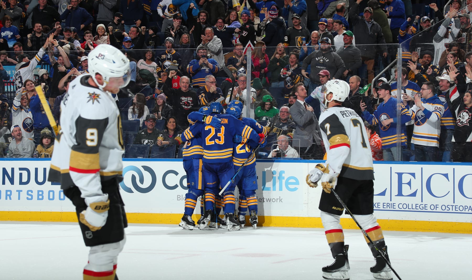 BUFFALO, NY - MARCH 10: Jack Eichel #9 and Alex Pietrangelo #7 of the Vegas Golden Knights react as Alex Tuch #89 of the Buffalo Sabres celebrates his empty-net goal in an NHL game on March 10, 2022 at KeyBank Center in Buffalo, New York. Buffalo won, 3-1.(Photo by Bill Wippert/NHLI via Getty Images)