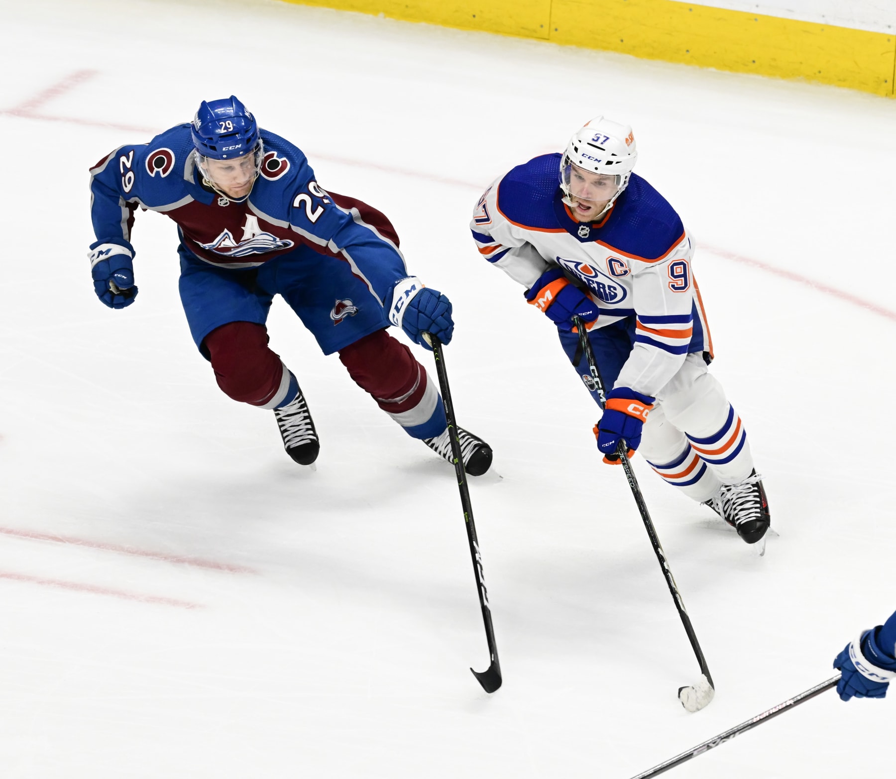 DENVER, CO - APRIL 11: Nathan MacKinnon (29) of the Colorado Avalanche defends against Connor McDavid (97) of the Edmonton Oilers in the second period at Ball Arena April 11, 2023. (Photo by Andy Cross/MediaNews Group/The Denver Post via Getty Images)