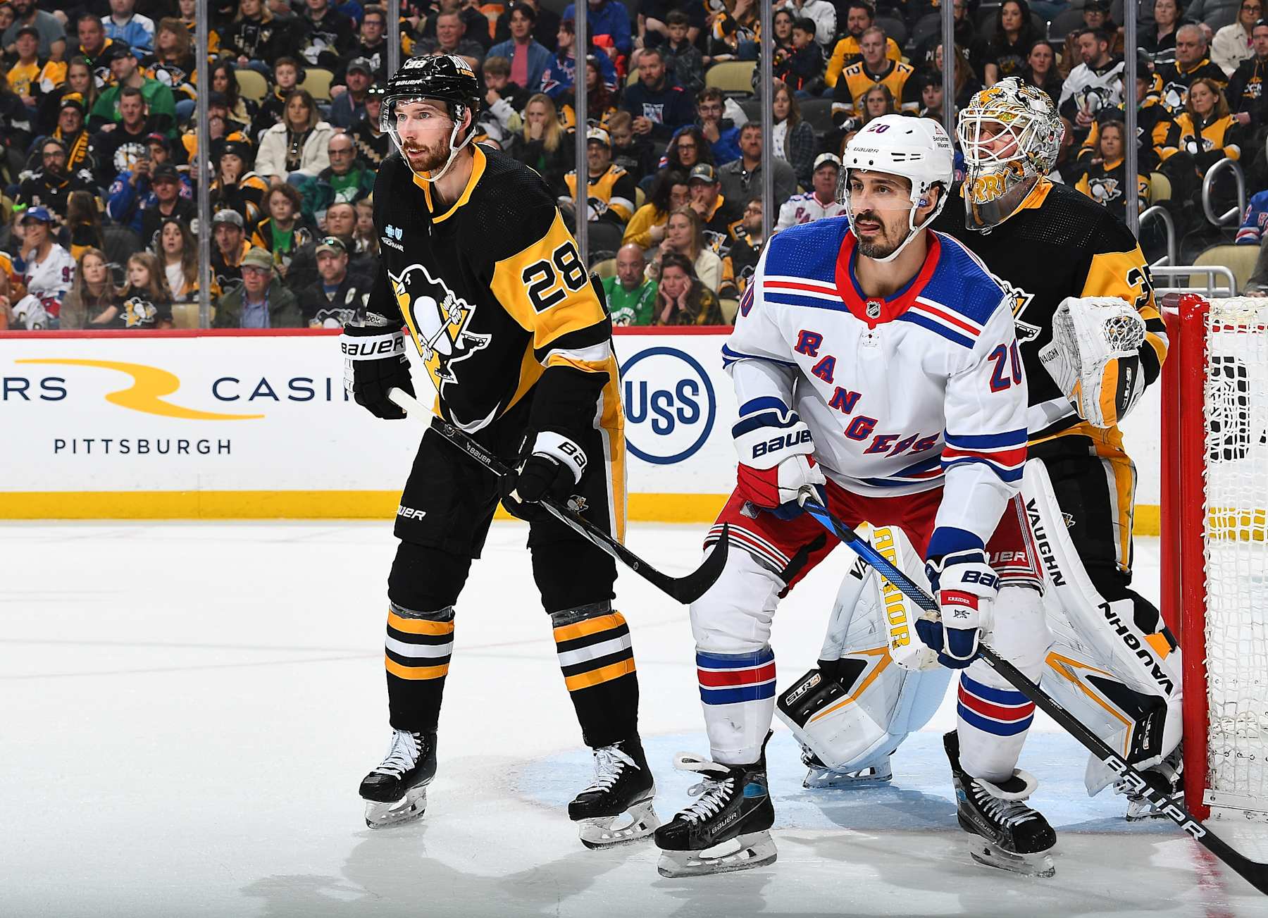 Pittsburgh Penguins defenseman Marcus Pettersson (left) and New York Rangers winger Chris Kreider. 
