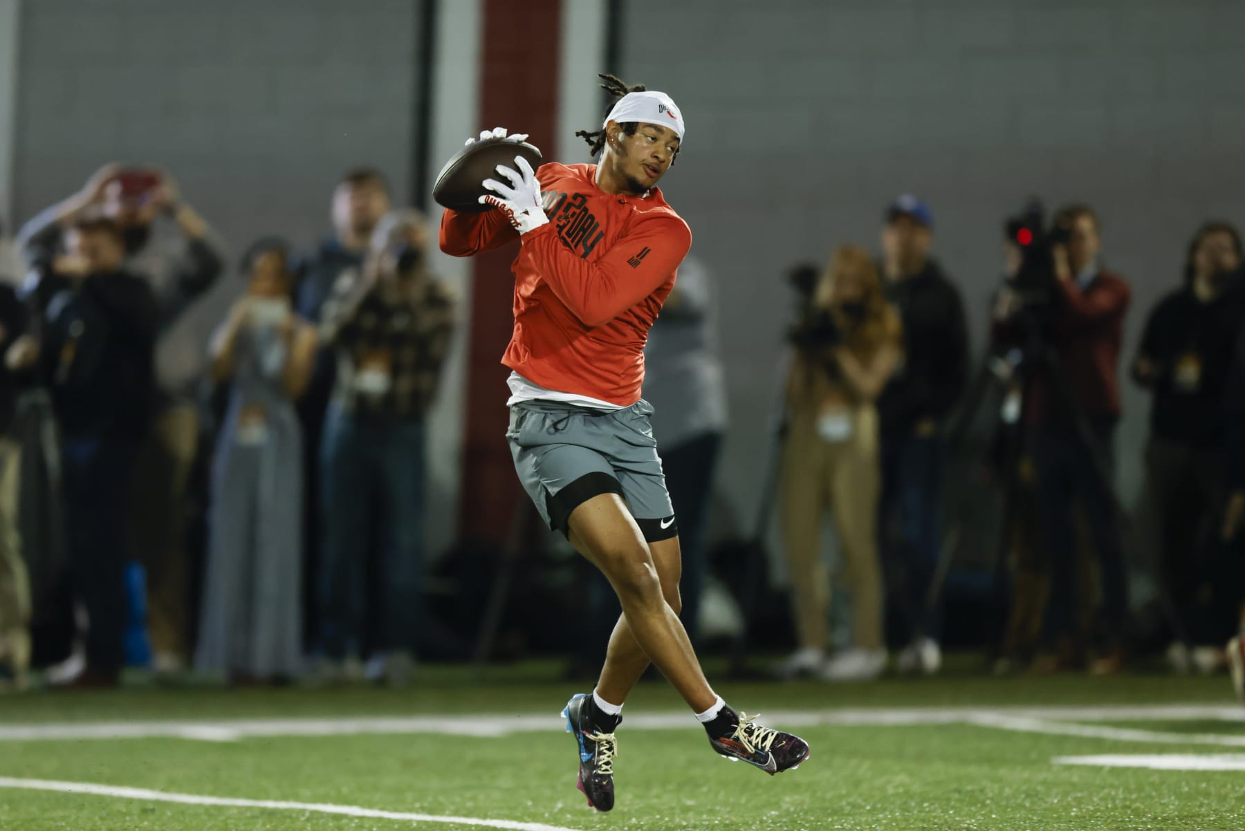 Ohio State football wide receiver Jaxon Smith-Njigba runs a drill at the school's NFL Pro Day in Columbus, Ohio, Wednesday, March 22, 2023. (AP Photo/Paul Vernon)