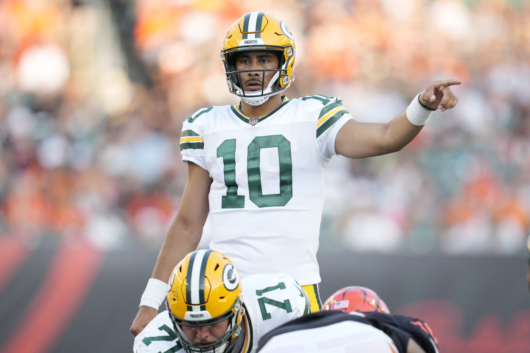 Green Bay Packers quarterback Jordan Love signals against the Cincinnati Bengals during the first half of a preseason NFL football game Friday, Aug. 11, 2023, in Cincinnati. (AP Photo/Michael Conroy)