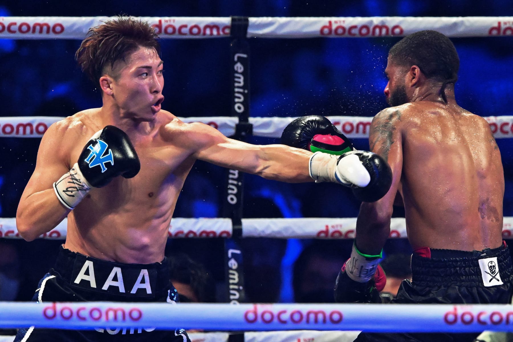 Naoya Inoue of Japan (L) and Stephen Fulton of the US fight in the WBC, WBO super bantamweight world title match at Ariake Arena in Tokyo on July 25, 2023. (Photo by Kazuhiro NOGI / AFP) (Photo by KAZUHIRO NOGI/AFP via Getty Images)