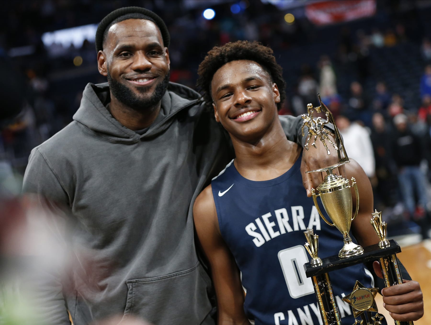 LeBron James, left, poses with his son Bronny after Sierra Canyon beat Akron St. Vincent - St. Mary in a high school basketball game, Saturday, Dec. 14, 2019, in Columbus, Ohio. (AP Photo/Jay LaPrete) LeBron James, left, poses with his son Bronny after Sierra Canyon beat Akron St. Vincent - St. Mary in a high school basketball game, Saturday, Dec. 14, 2019, in Columbus, Ohio. (AP Photo/Jay LaPrete)
