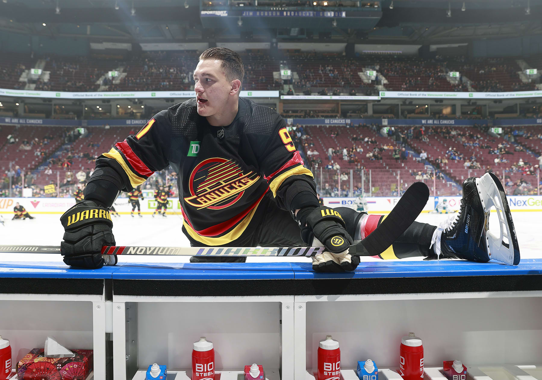 VANCOUVER, CANADA - DECEMBER 23: Nikita Zadorov #91 of the Vancouver Canucks stretches during their NHL game against the San Jose Sharks at Rogers Arena on December 23, 2023 in Vancouver, British Columbia, Canada.  (Photo by Jeff Vinnick/NHLI via Getty Images)