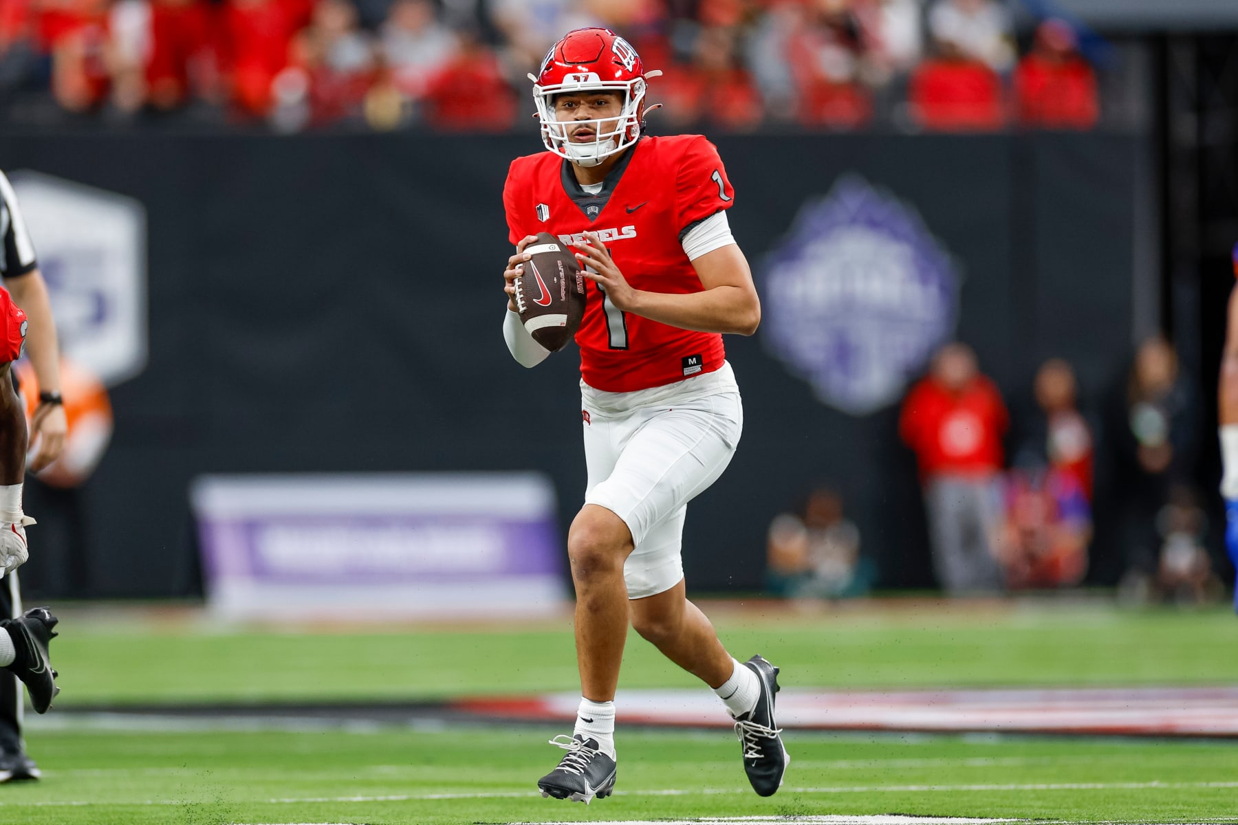 LAS VEGAS, NV - DECEMBER 02: UNLV Rebels quarterback Jayden Maiava (1) looks for an open receiver in the first quarter against the Boise State Broncos during the Mountain West Championship Game on December 2, 2023, at Allegiant Stadium in Las Vegas, NV. (Photo by Brandon Sloter/Icon Sportswire via Getty Images)