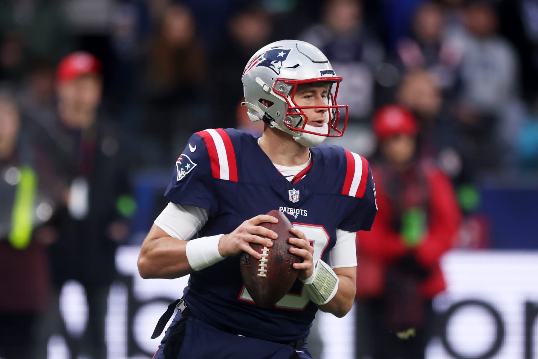 FRANKFURT AM MAIN, GERMANY - NOVEMBER 12: Mac Jones #10 of the New England Patriots looks to pass from the pocket in the second quarter during the NFL match between the Indianapolis Colts and the New England Patriots at Deutsche Bank Park on November 12, 2023 in Frankfurt am Main, Germany. (Photo by Alex Grimm/Getty Images)