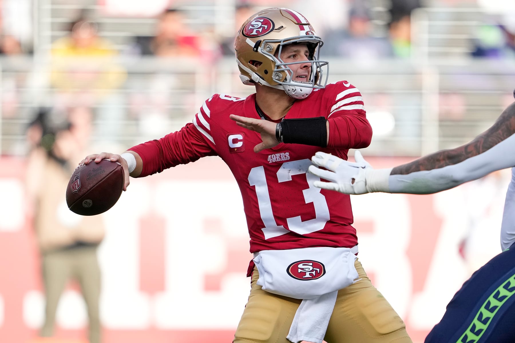 SANTA CLARA, CALIFORNIA - DECEMBER 10: Brock Purdy #13 of the San Francisco 49ers looks to pass during the second quarter in the game against the Seattle Seahawks at Levi's Stadium on December 10, 2023 in Santa Clara, California. (Photo by Thearon W. Henderson/Getty Images)