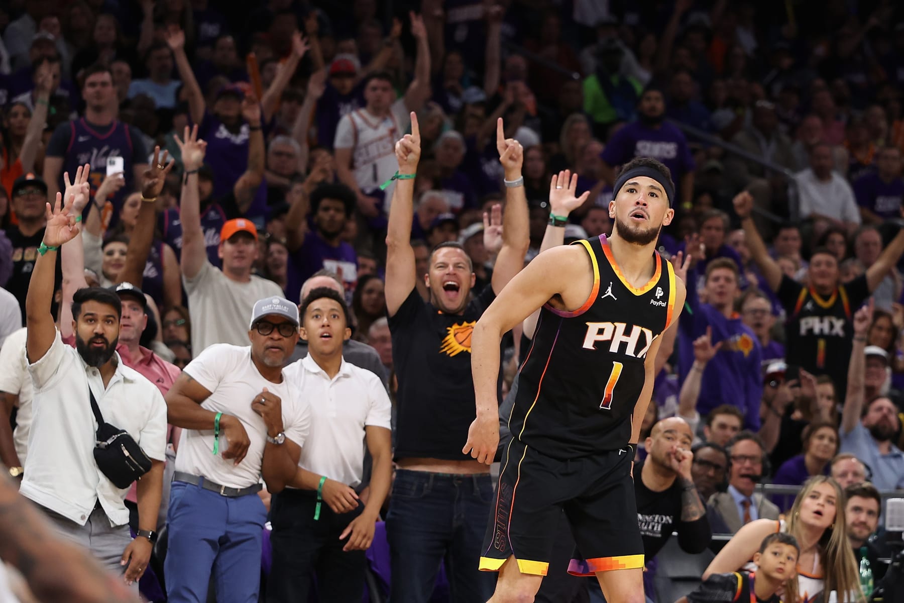 PHOENIX, ARIZONA - APRIL 28: Devin Booker #1 of the Phoenix Suns watches a three-point shot against the Minnesota Timberwolves during the second half of game four of the Western Conference First Round Playoffs at Footprint Center on April 28, 2024 in Phoenix, Arizona. The Timberwolves defeated the Suns 122-116 and win the series 4-0.  NOTE TO USER: User expressly acknowledges and agrees that, by downloading and or using this photograph, User is consenting to the terms and conditions of the Getty Images License Agreement.  (Photo by Christian Petersen/Getty Images)