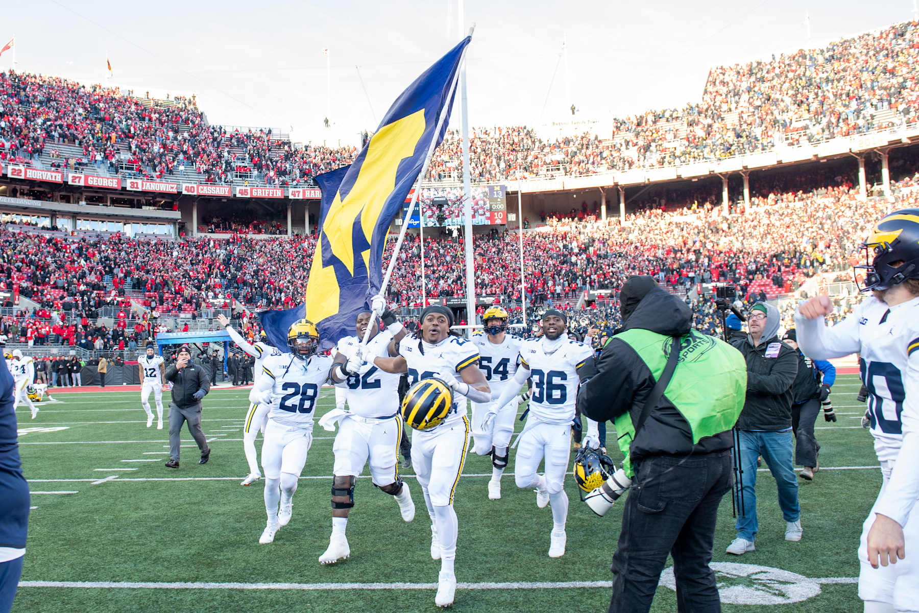 Michigan Wolverines run to plant the team's flag