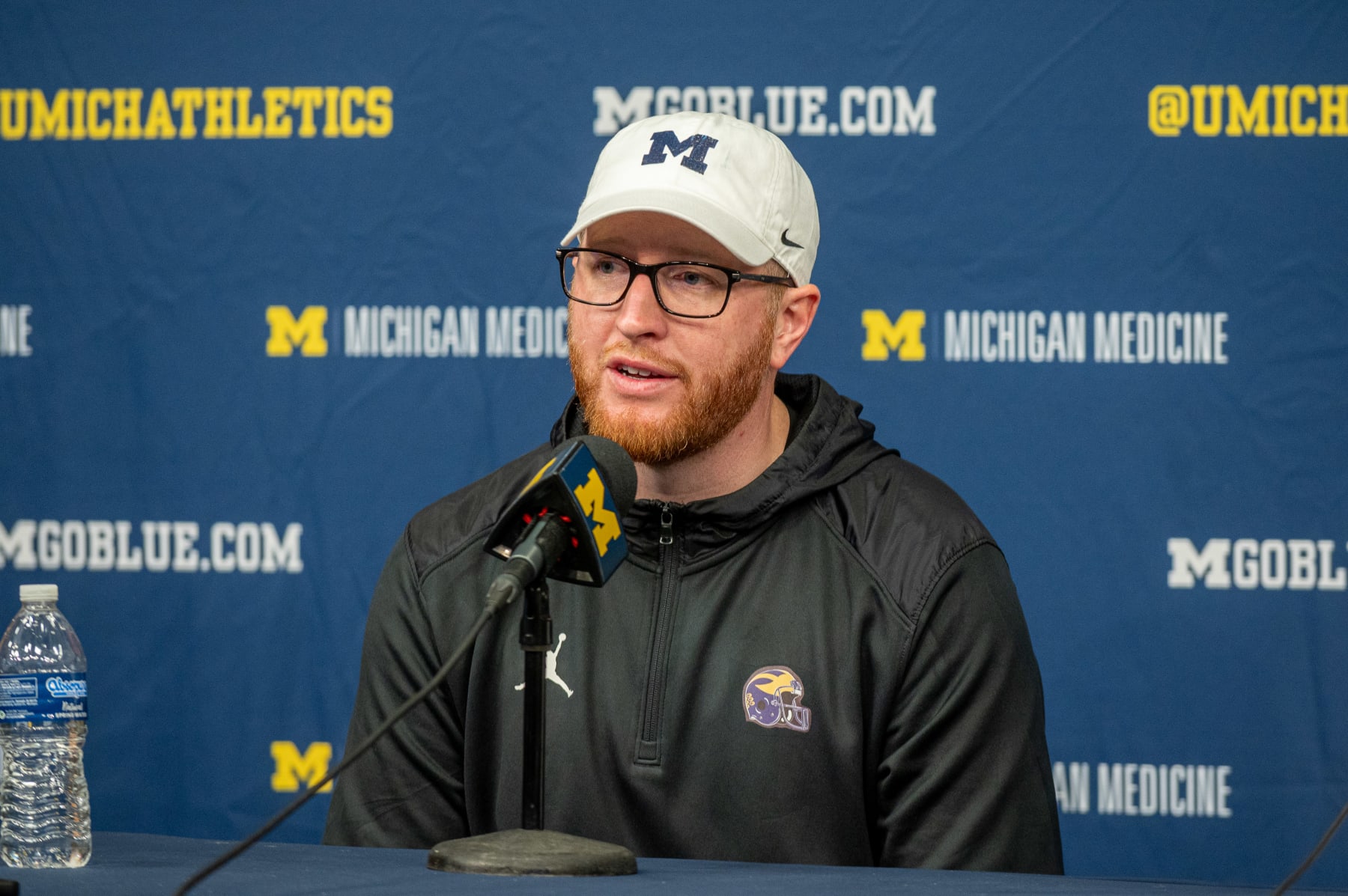 ANN ARBOR, MICHIGAN - SEPTEMBER 09: Acting Head Coach Jay Harbaugh of the Michigan Wolverines speaks to media during the post game press conference after a college football game against the UNLV Rebels at Michigan Stadium on September 09, 2023 in Ann Arbor, Michigan. The Michigan Wolverines won the game 35-7. (Photo by Aaron J. Thornton/Getty Images)