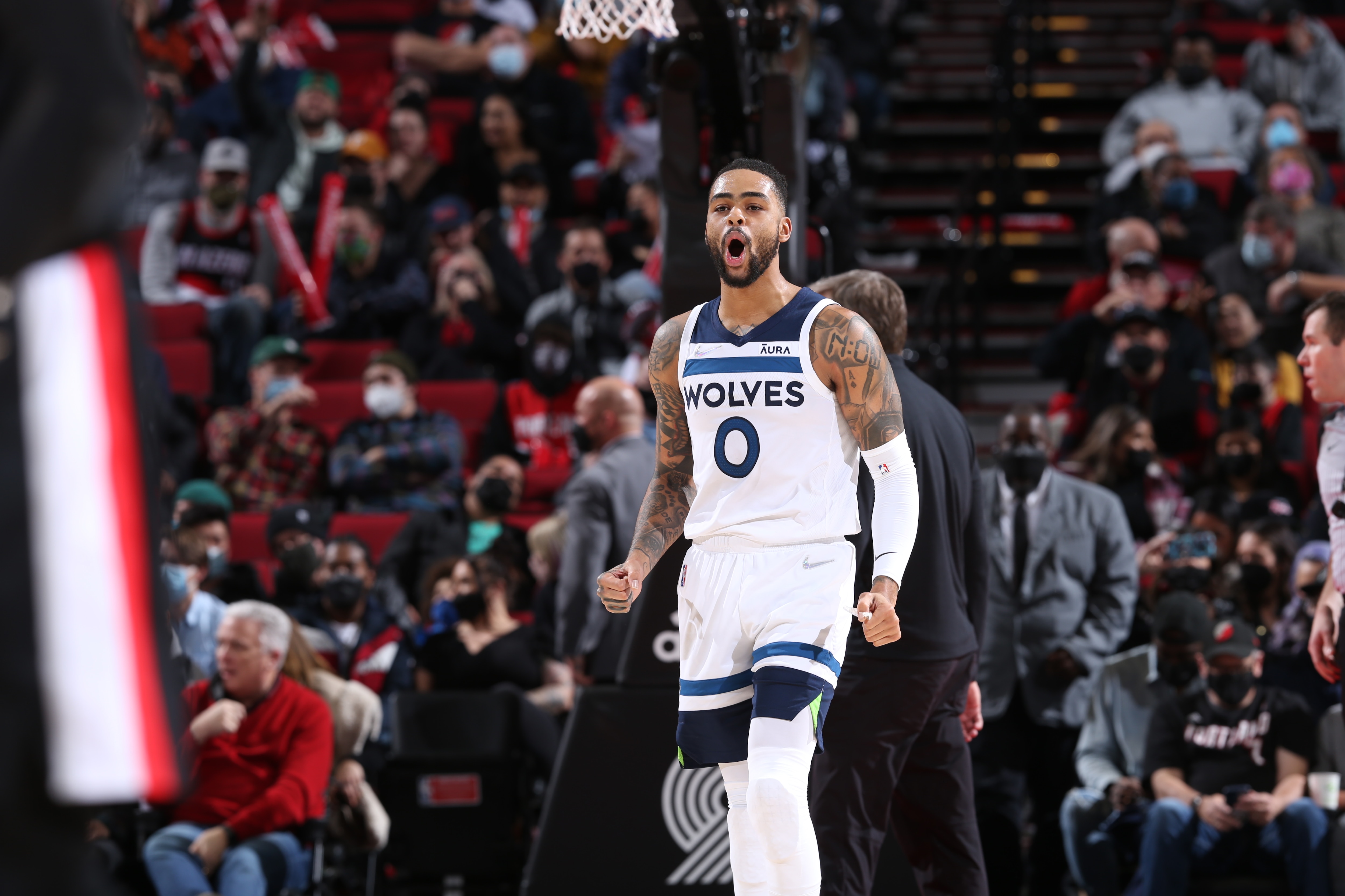 PORTLAND, OR - JANUARY 25:  D'Angelo Russell #0 of the Minnesota Timberwolves celebrates during the game against the Portland Trail Blazers on January 25, 2022 at the Moda Center Arena in Portland, Oregon. NOTE TO USER: User expressly acknowledges and agrees that, by downloading and or using this photograph, user is consenting to the terms and conditions of the Getty Images License Agreement. Mandatory Copyright Notice: Copyright 2022 NBAE (Photo by Sam Forencich/NBAE via Getty Images)