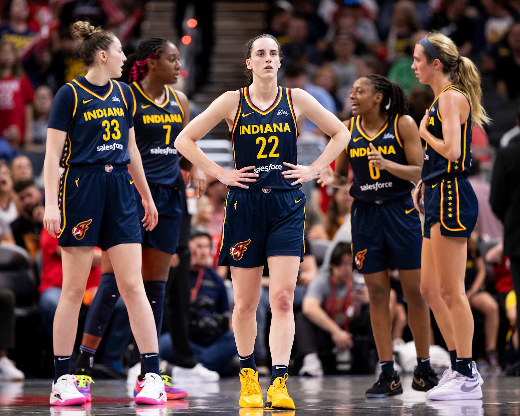 INDIANAPOLIS, INDIANA - AUGUST 18: Caitlin Clark #22 of the Indiana Fever with teammates Katie Lou Samuelson #33, Aliyah Boston #7, Kelsey Mitchell #0 and Lexie Hull #10 after a second half timeout during a game against the Seattle Storm at Gainbridge Fieldhouse on August 18, 2024 in Indianapolis, Indiana. NOTE TO USER: User expressly acknowledges and agrees that, by downloading and or using this photograph, User is consenting to the terms and conditions of the Getty Images License Agreement.(Photo by Chet White/Getty Images)