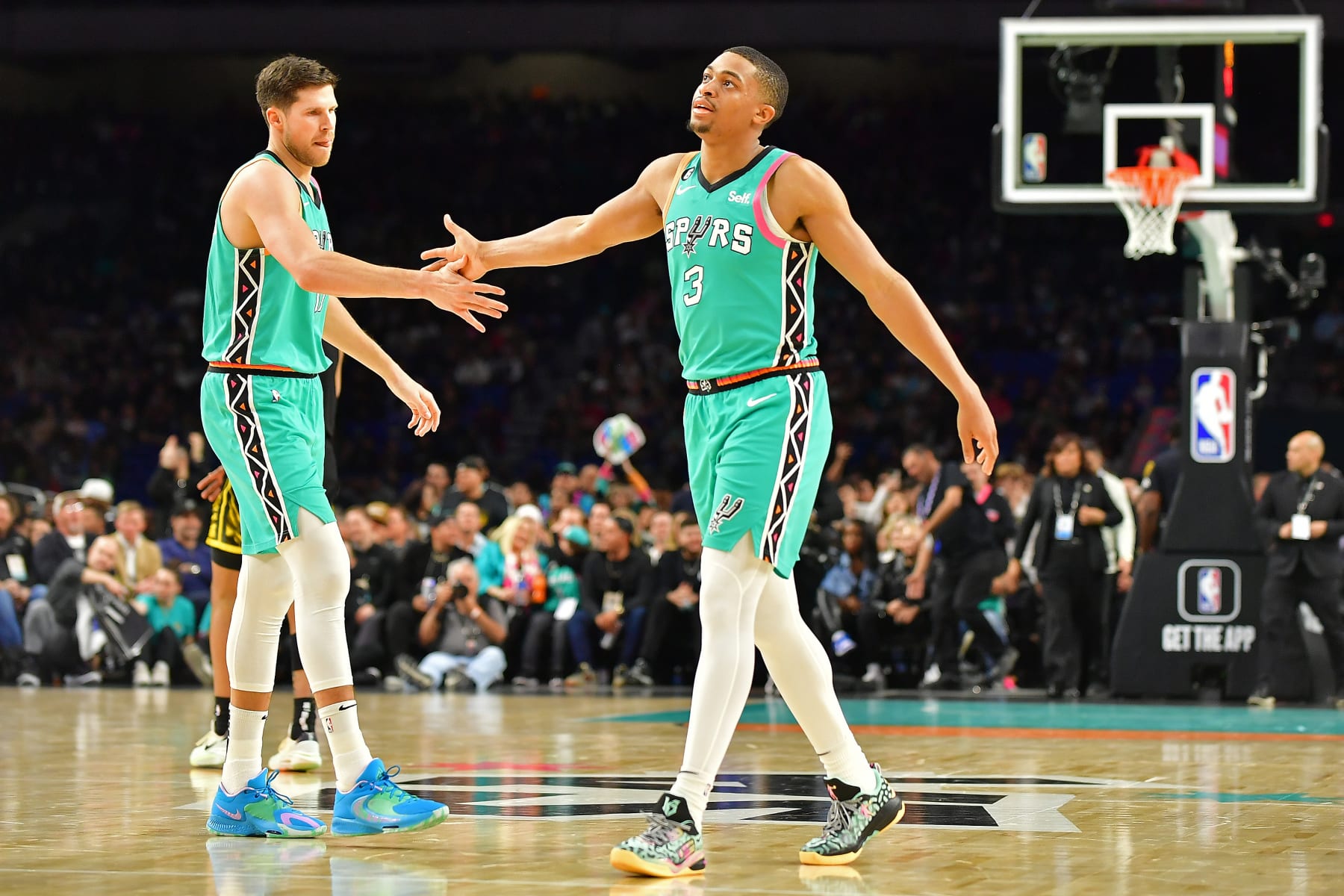 SAN ANTONIO, TX - JANUARY 13: Keldon Johnson #3 and Doug McDermott #17 of the San Antonio Spurs high five during the game against the Golden State Warriors on January 13, 2023 at the Alamodome in San Antonio, Texas. NOTE TO USER: User expressly acknowledges and agrees that, by downloading and or using this photograph, user is consenting to the terms and conditions of the Getty Images License Agreement. Mandatory Copyright Notice: Copyright 2023 NBAE (Photos by Michael Gonzales/NBAE via Getty Images)