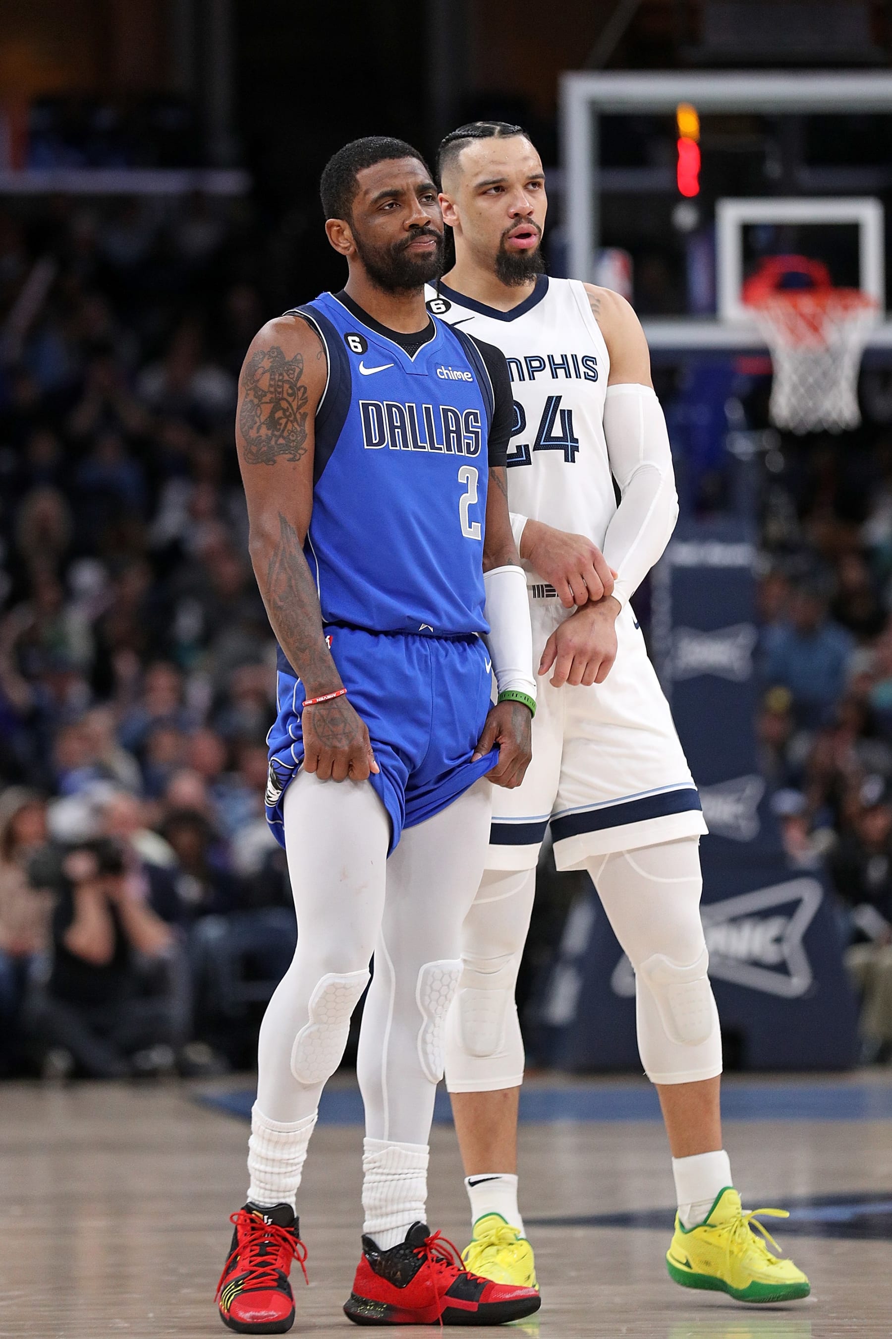 MEMPHIS, TENNESSEE - MARCH 20: Kyrie Irving #2 of the Dallas Mavericks and Dillon Brooks #24 of the Memphis Grizzlies look on during the first half at FedExForum on March 20, 2023 in Memphis, Tennessee. NOTE TO USER: User expressly acknowledges and agrees that, by downloading and or using this photograph, User is consenting to the terms and conditions of the Getty Images License Agreement. (Photo by Justin Ford/Getty Images)