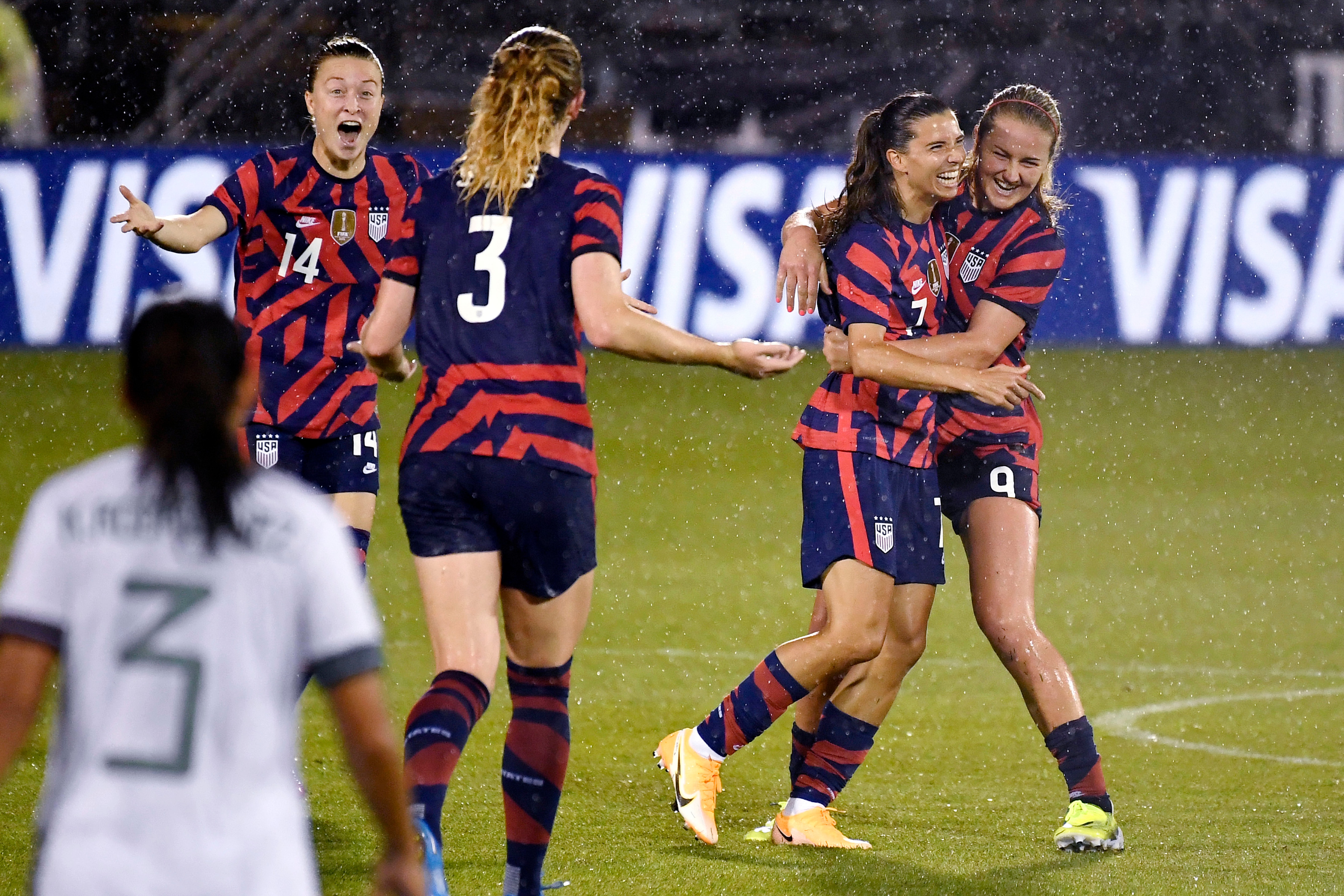 United States' Tobin Heath (7) celebrates her goal with teammates Emily Sonnett (14), Samantha Mewis (3), and Lindsey Horan (9) during the second half of the team's international friendly soccer match against Mexico, Thursday, July 1, 2021, in East Hartford, Conn. (AP Photo/Jessica Hill)