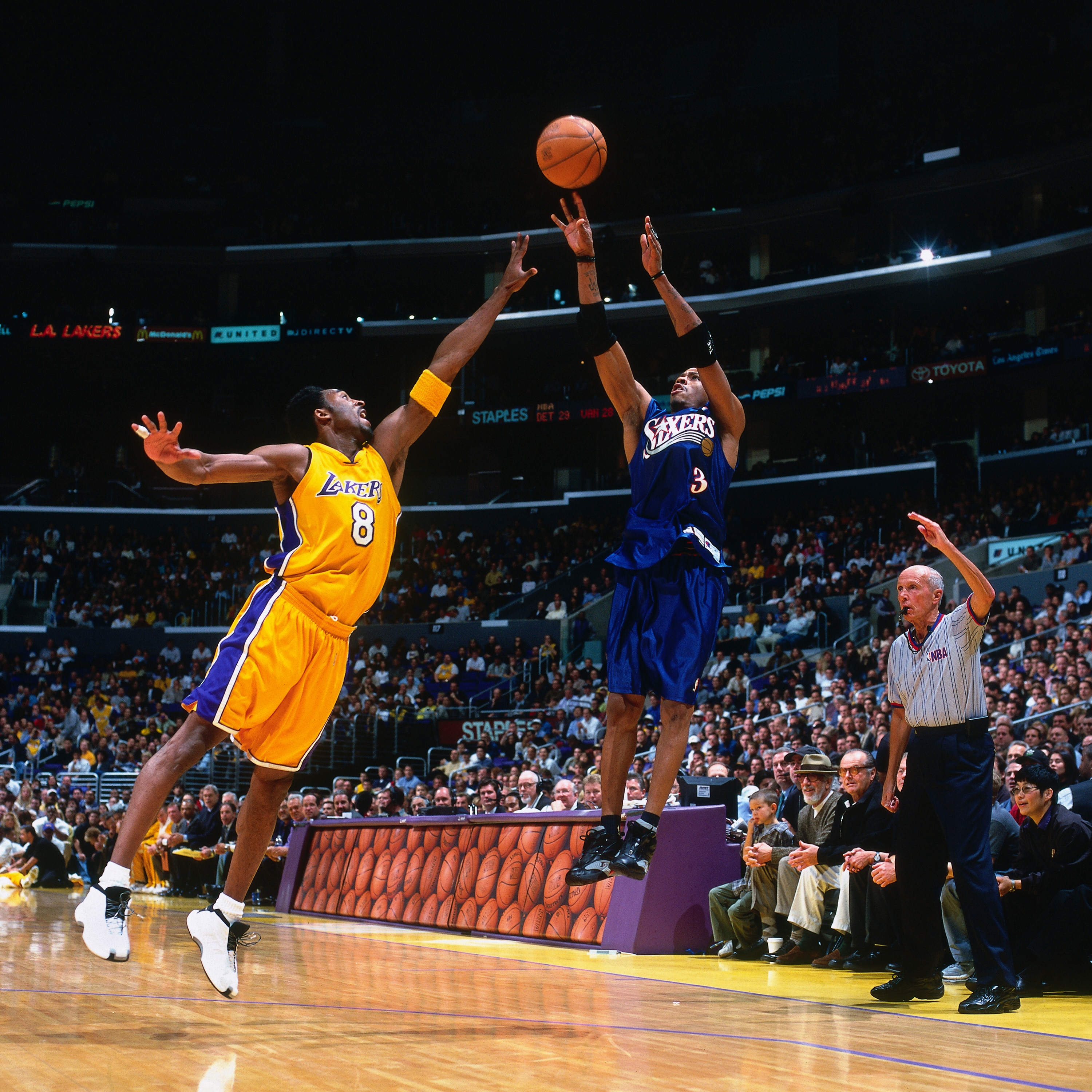 LOS ANGELES, CA -DEC 5:  Allen Iverson #3 of the Philadelphia 76ers takes a shot against Kobe Bryant #8 of the Los Angeles Lakers at the Staples Center on December 5, 2000. NOTE TO USER: User expressly acknowledges and agrees that, by downloading and or using this photograph, user is consenting to the terms and conditions of the Getty Images License Agreement. Mandatory Copyright Notice: Copyright 2014 NBAE (Photos by Robert Mora/NBAE via Getty Images)