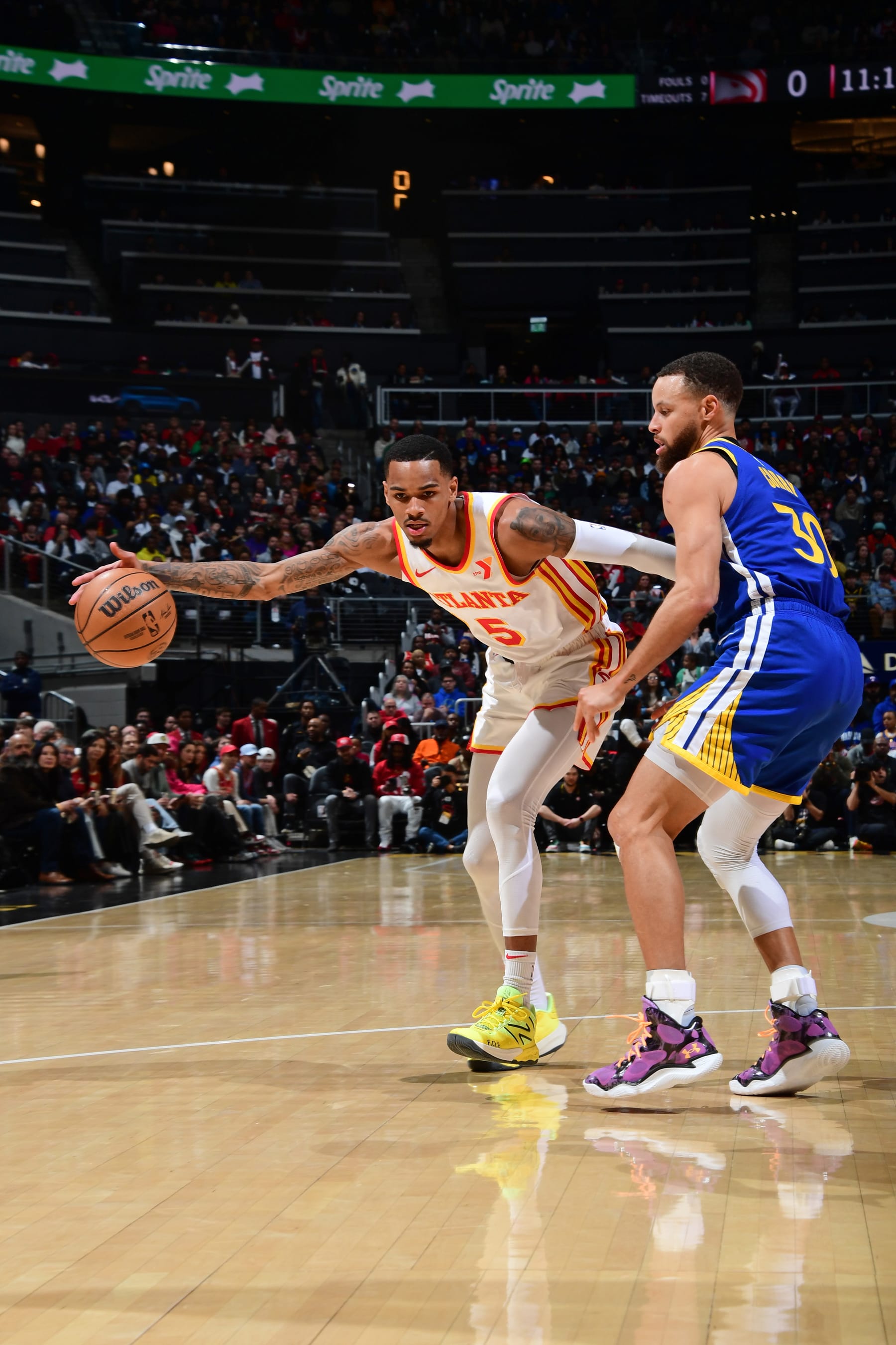 ATLANTA, GA - FEBRUARY 3: Dejounte Murray #5 of the Atlanta Hawks dribbles the ball during the game against the Golden State Warriors on February 3, 2024 at State Farm Arena in Atlanta, Georgia.  NOTE TO USER: User expressly acknowledges and agrees that, by downloading and/or using this Photograph, user is consenting to the terms and conditions of the Getty Images License Agreement. Mandatory Copyright Notice: Copyright 2024 NBAE (Photo by Scott Cunningham/NBAE via Getty Images)