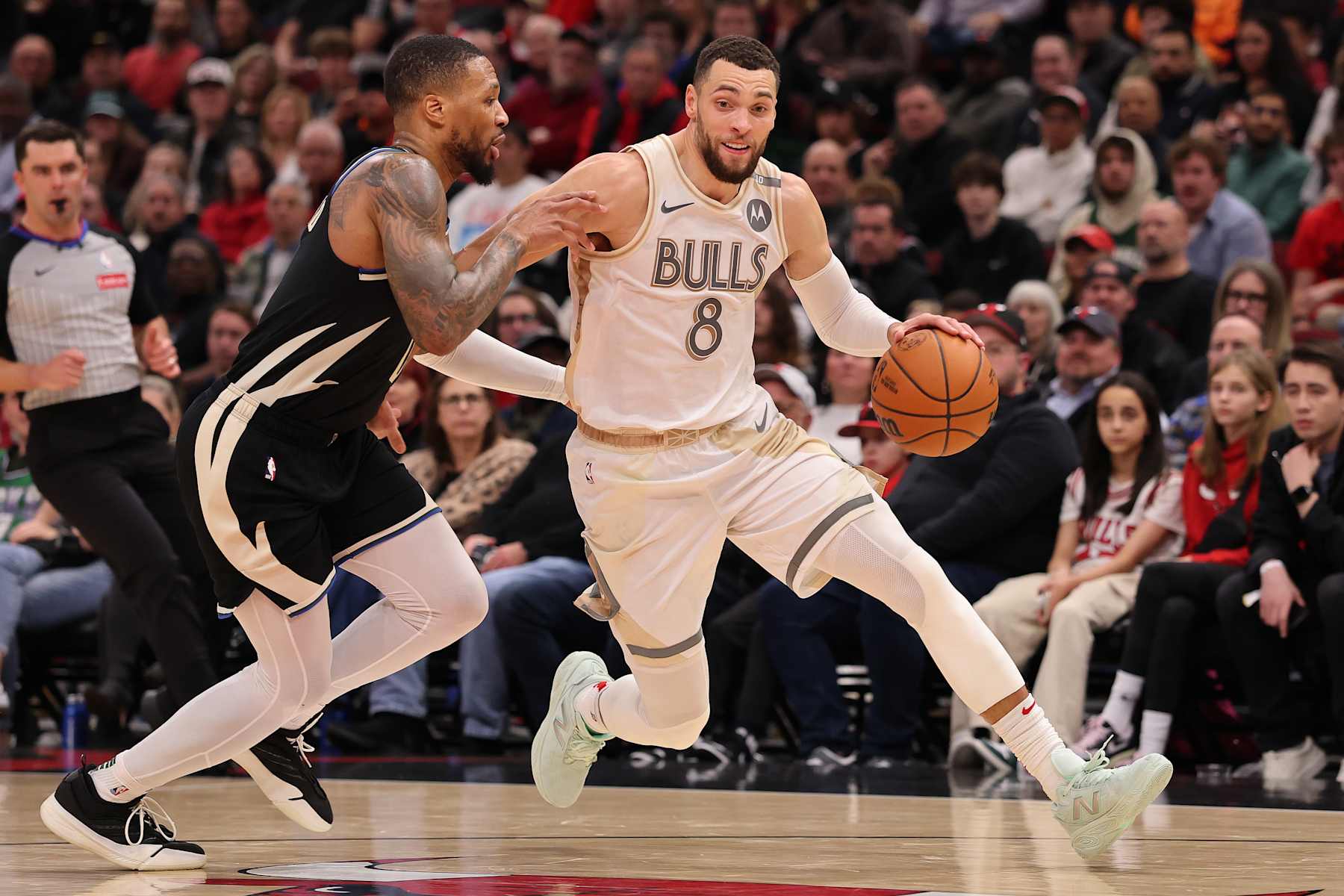 CHICAGO, ILLINOIS - DECEMBER 28: Zach LaVine #8 of the Chicago Bulls drives to the basket against Damian Lillard #0 of the Milwaukee Bucks during the second half at the United Center on December 28, 2024 in Chicago, Illinois. NOTE TO USER: User expressly acknowledges and agrees that, by downloading and or using this photograph, User is consenting to the terms and conditions of the Getty Images License Agreement.  (Photo by Michael Reaves/Getty Images)