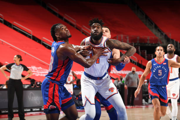 DETROIT, MI - APRIL 3: Isaiah Stewart #28 of the Detroit Pistons and Norvel Pelle #14 of the New York Knicks fight for position during the game on April 3, 2021 at Little Caesars Arena in Detroit, Michigan. NOTE TO USER: User expressly acknowledges and agrees that, by downloading and/or using this photograph, User is consenting to the terms and conditions of the Getty Images License Agreement. Mandatory Copyright Notice: Copyright 2021 NBAE (Photo by Chris Schwegler/NBAE via Getty Images)