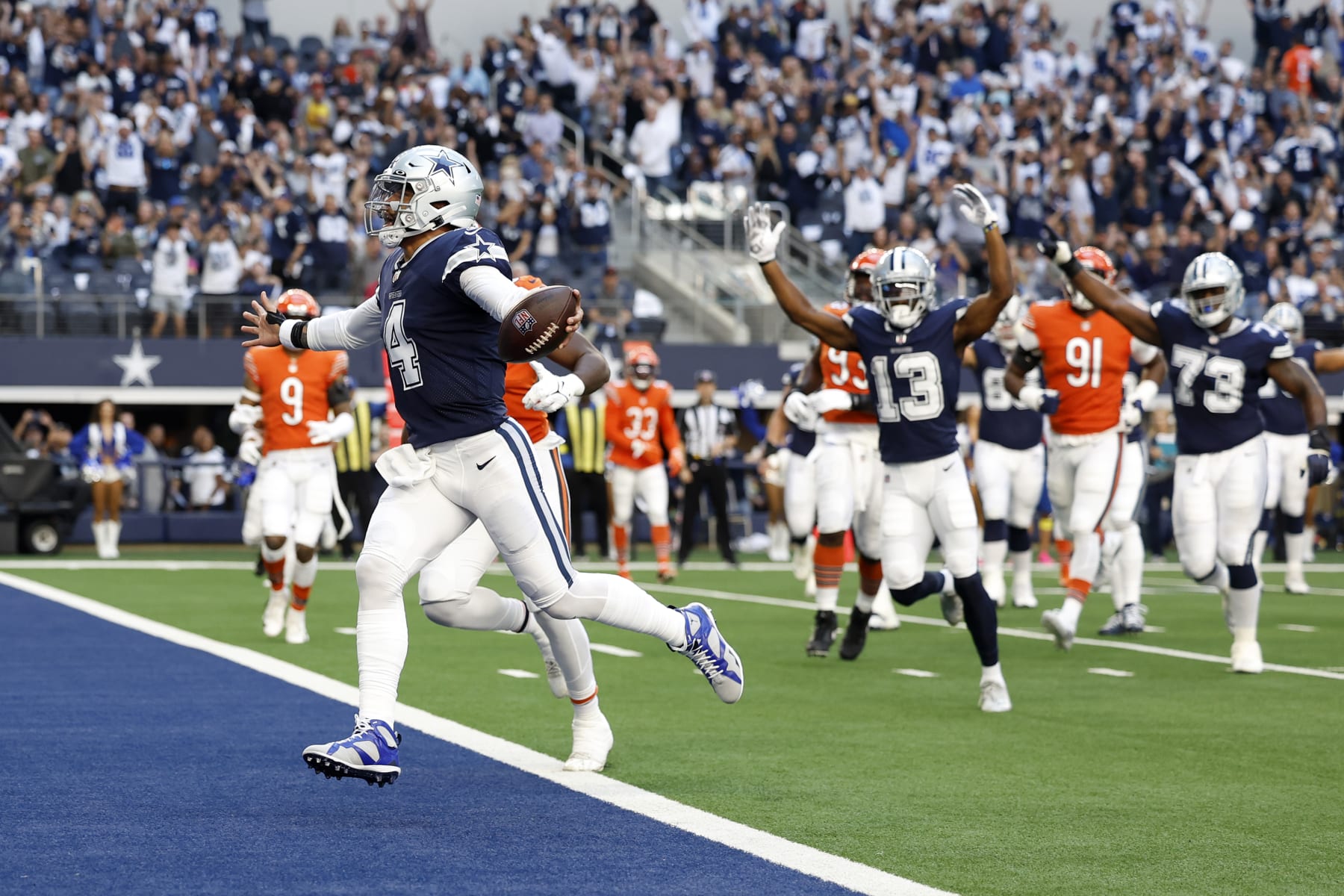 ARLINGTON, TEXAS - OCTOBER 30: Dak Prescott #4 of the Dallas Cowboys rushes for a seven yard touchdown against the Chicago Bears during the first quarter at AT&T Stadium on October 30, 2022 in Arlington, Texas. (Photo by Wesley Hitt/Getty Images)