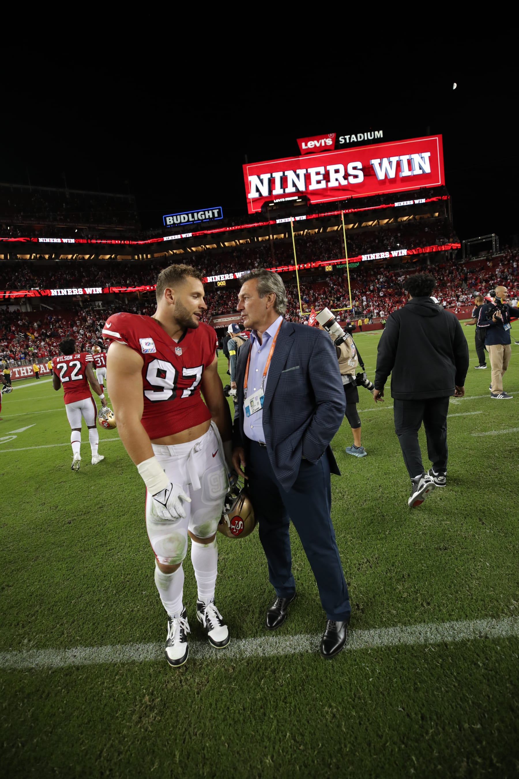 San Francisco 49ers defensive end Nick Bosa (left) and general manager John Lynch (right)