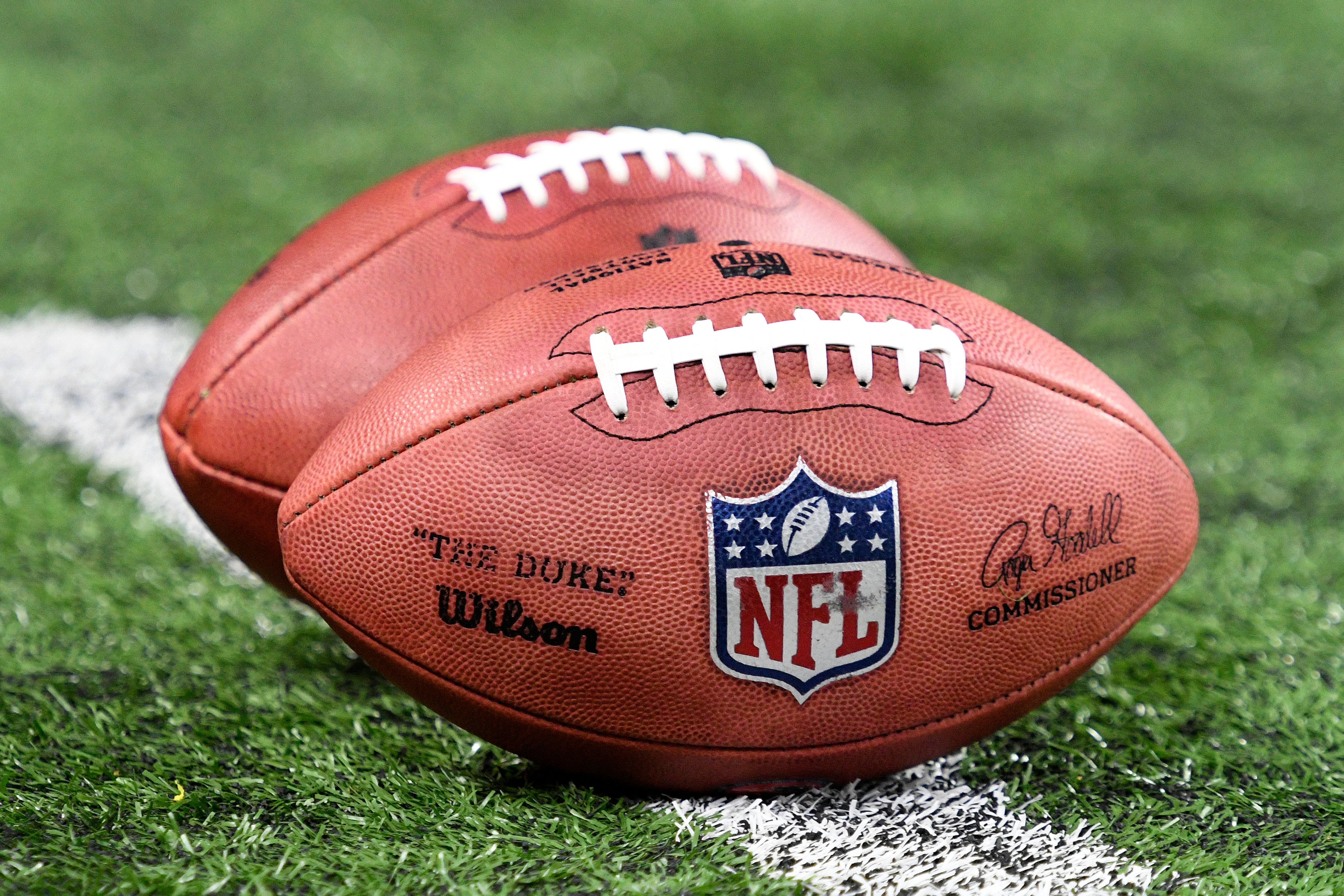 INDIANAPOLIS, IN - DECEMBER 18: An NFL logo is seen on the side of a football before the NFL football game between the New England Patriots and the Indianapolis Colts on December 18, 2021, at Lucas Oil Stadium in Indianapolis, Indiana. (Photo by Michael Allio/Icon Sportswire via Getty Images)