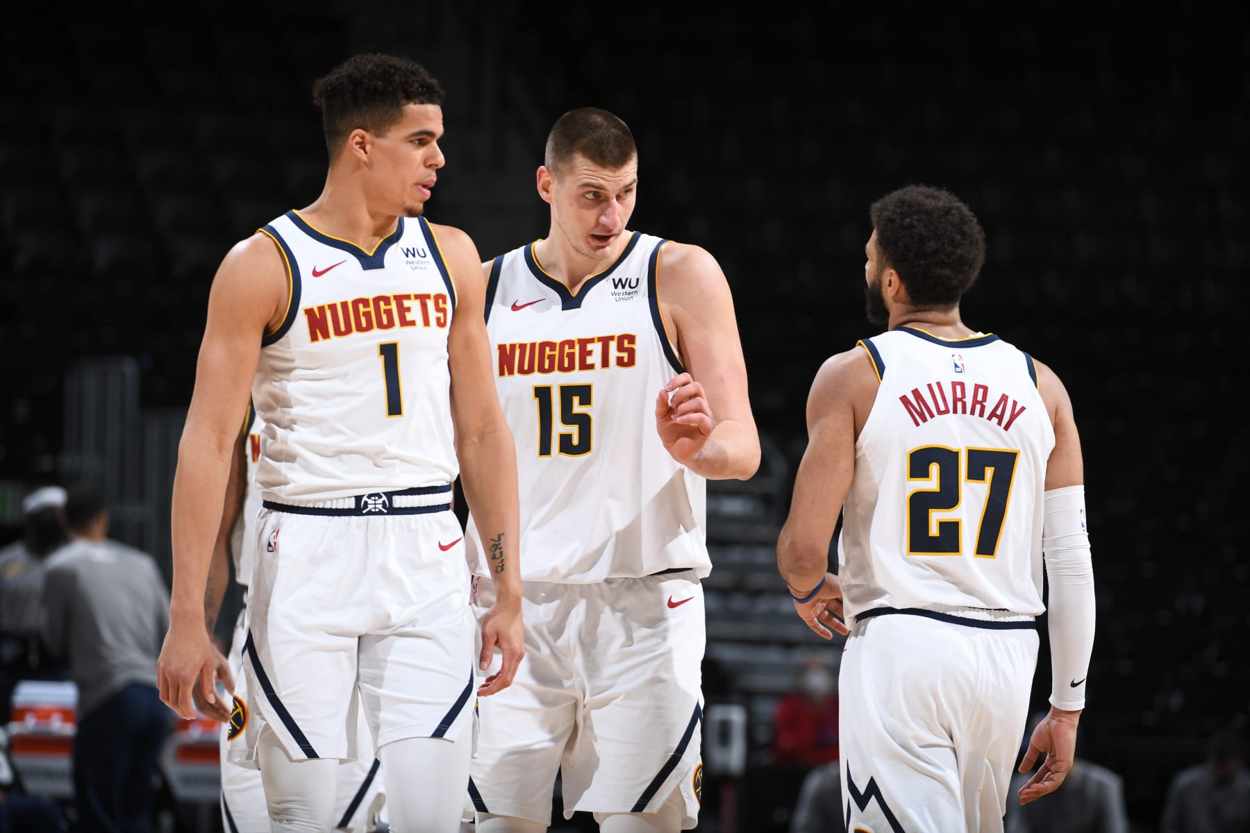 DENVER, CO - MARCH 15 : Michael Porter Jr. #1 of the Denver Nuggets and Nikola Jokic #15 of the Denver Nuggets talk to Jamal Murray #27 of the Denver Nuggets during the game against the Indiana Pacers on March 15, 2021 at the Ball Arena in Denver, Colorado. NOTE TO USER: User expressly acknowledges and agrees that, by downloading and/or using this Photograph, user is consenting to the terms and conditions of the Getty Images License Agreement. Mandatory Copyright Notice: Copyright 2021 NBAE (Photo by Garrett Ellwood/NBAE via Getty Images)