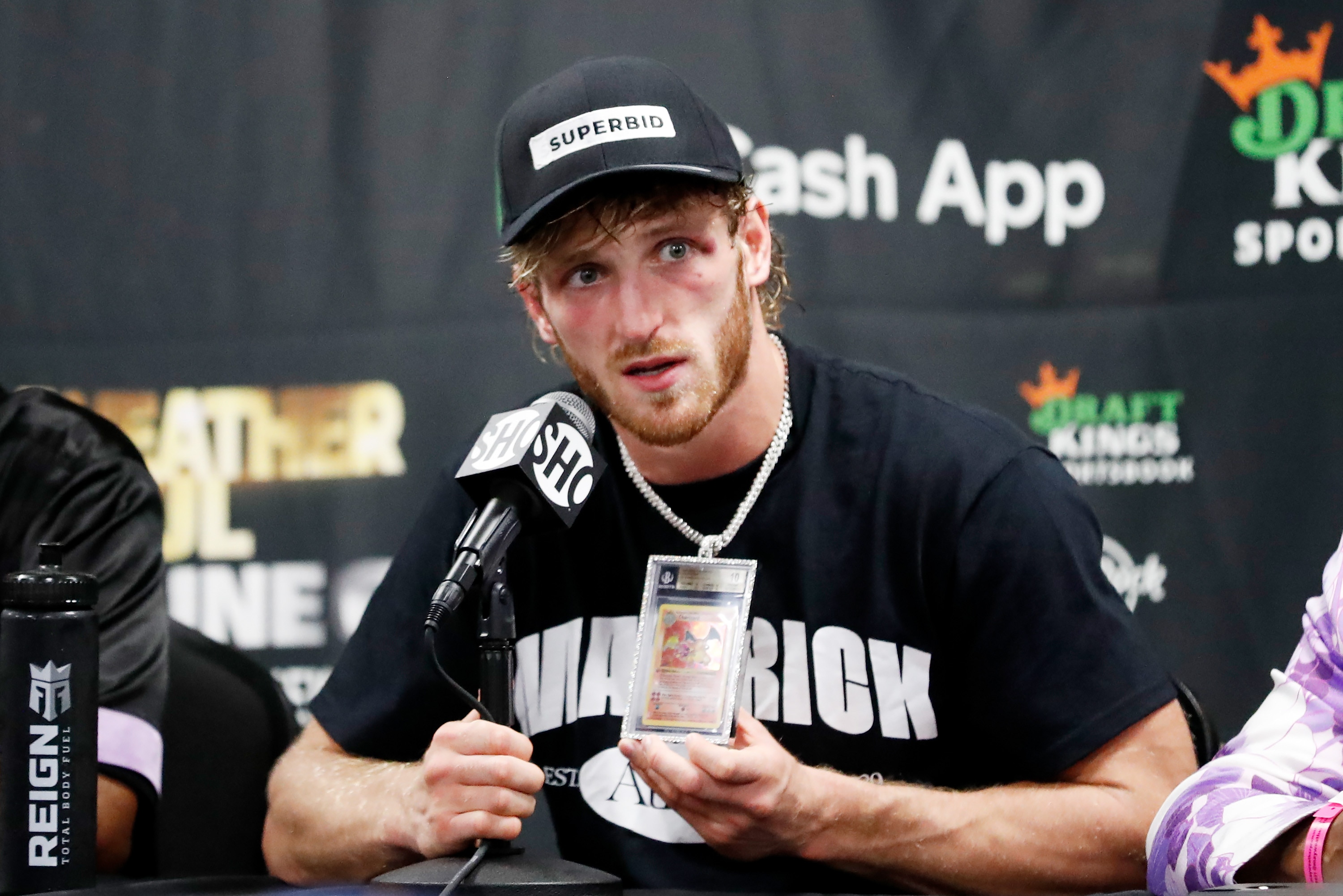 MIAMI GARDENS, FLORIDA - JUNE 06: Logan Paul talks about his Charizard Pokemon card chain during his press conference following his contracted exhibition boxing match against Floyd Mayweather at Hard Rock Stadium on June 06, 2021 in Miami Gardens, Florida. (Photo by Cliff Hawkins/Getty Images)