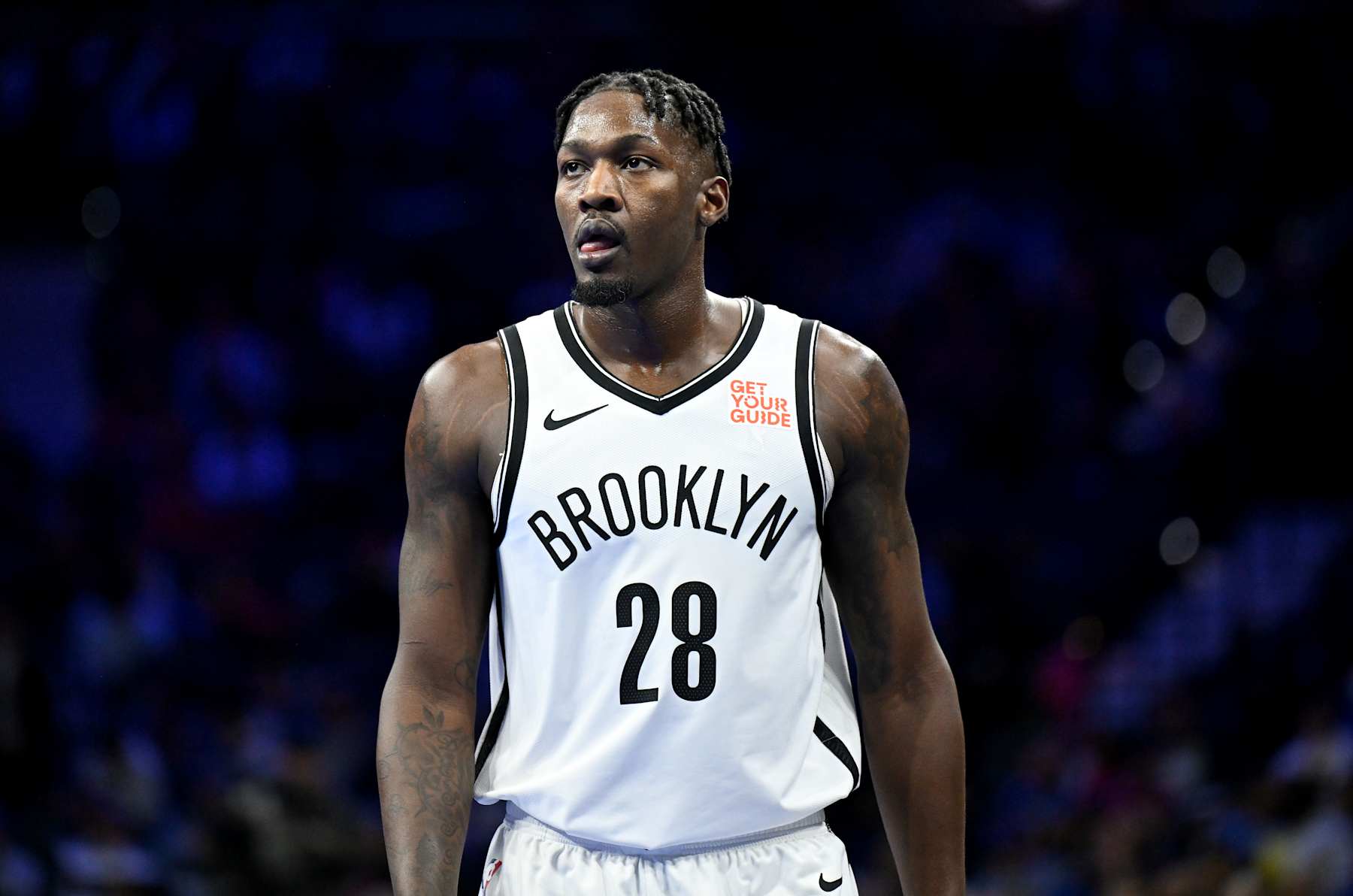 PHILADELPHIA, PENNSYLVANIA - NOVEMBER 22: Dorian Finney-Smith #28 of the Brooklyn Nets rests during a break in the game against the Philadelphia 76ers during the NBA Emirates Cup at the Wells Fargo Center on November 22, 2024 in Philadelphia, Pennsylvania. NOTE TO USER: User expressly acknowledges and agrees that, by downloading and or using this photograph, User is consenting to the terms and conditions of the Getty Images License Agreement. (Photo by G Fiume/Getty Images)