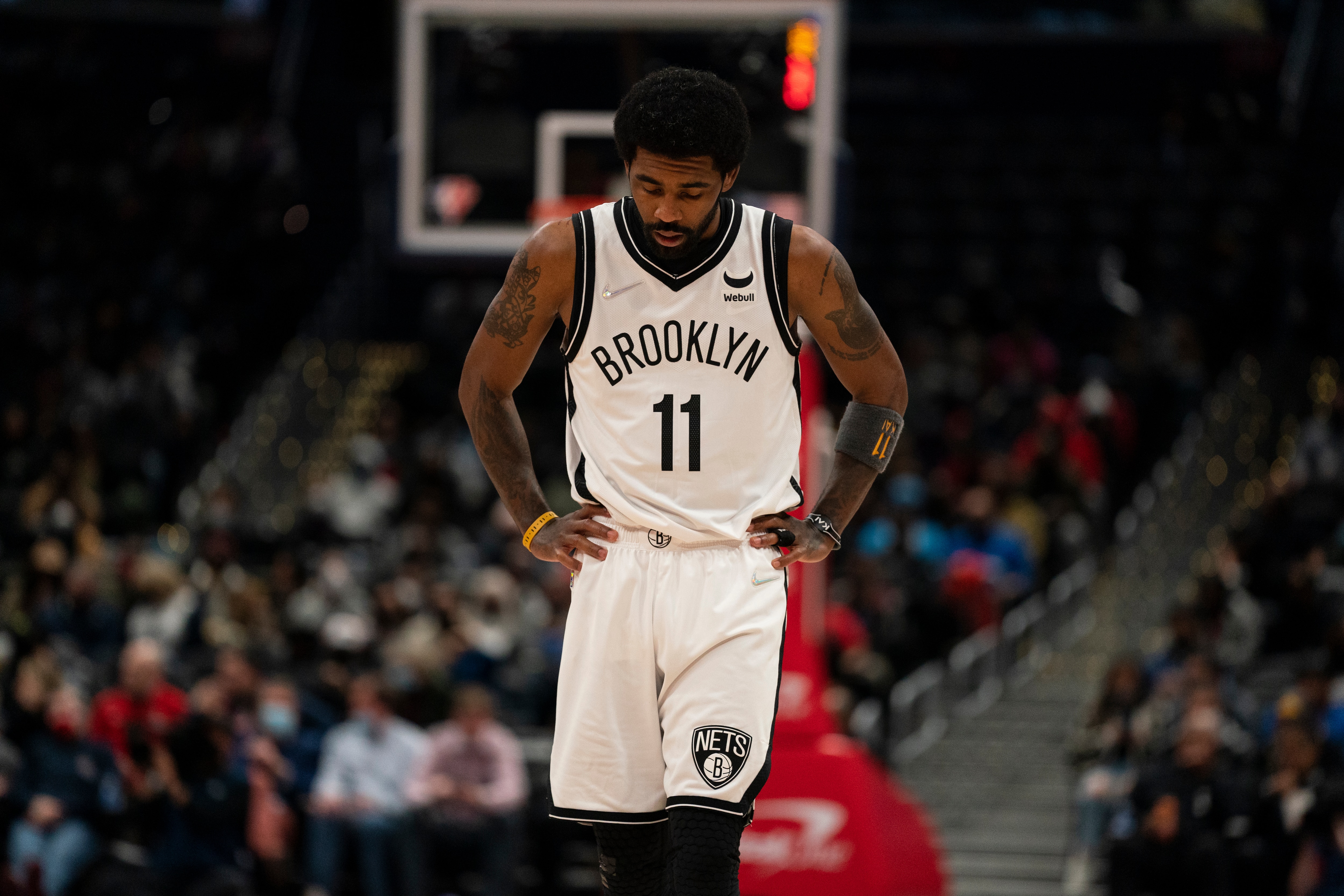 Brooklyn Nets guard Kyrie Irving (11) pauses during the first half of an NBA basketball game against the Washington Wizards, Wednesday, Jan. 19, 2022, in Washington. (AP Photo/Evan Vucci)