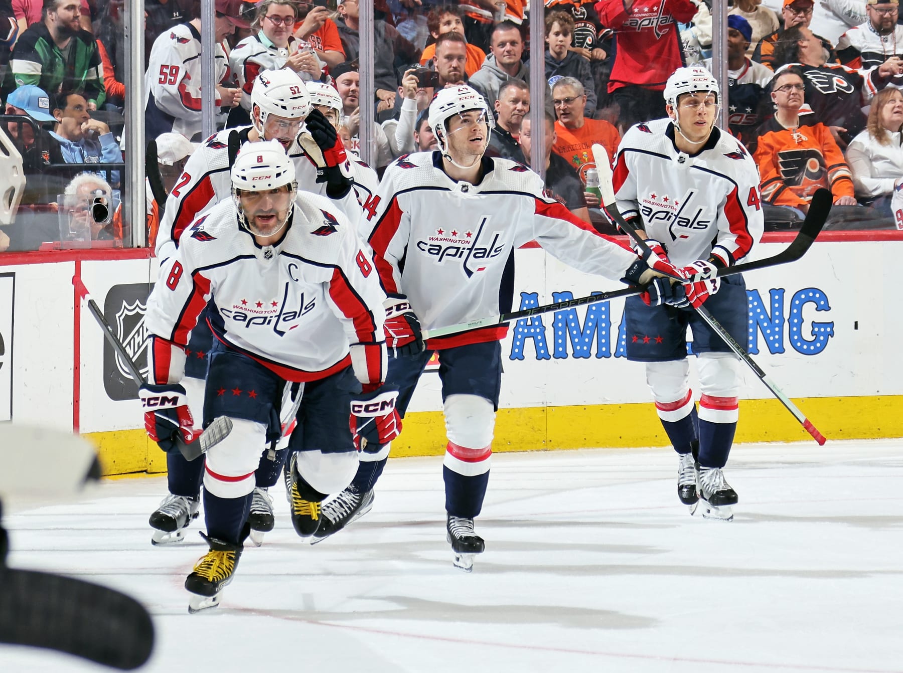 PHILADELPHIA, PENNSYLVANIA - APRIL 16: Alex Ovechkin #8 of the Washington Capitals celebrates his first period goal against the Philadelphia Flyers with Dylan McIlrath #52, T.J. Oshie #77, Connor McMichael #24, and Martin Fehervary #42 at the Wells Fargo Center on April 16, 2024 in Philadelphia, Pennsylvania.  (Photo by Len Redkoles/NHLI via Getty Images)